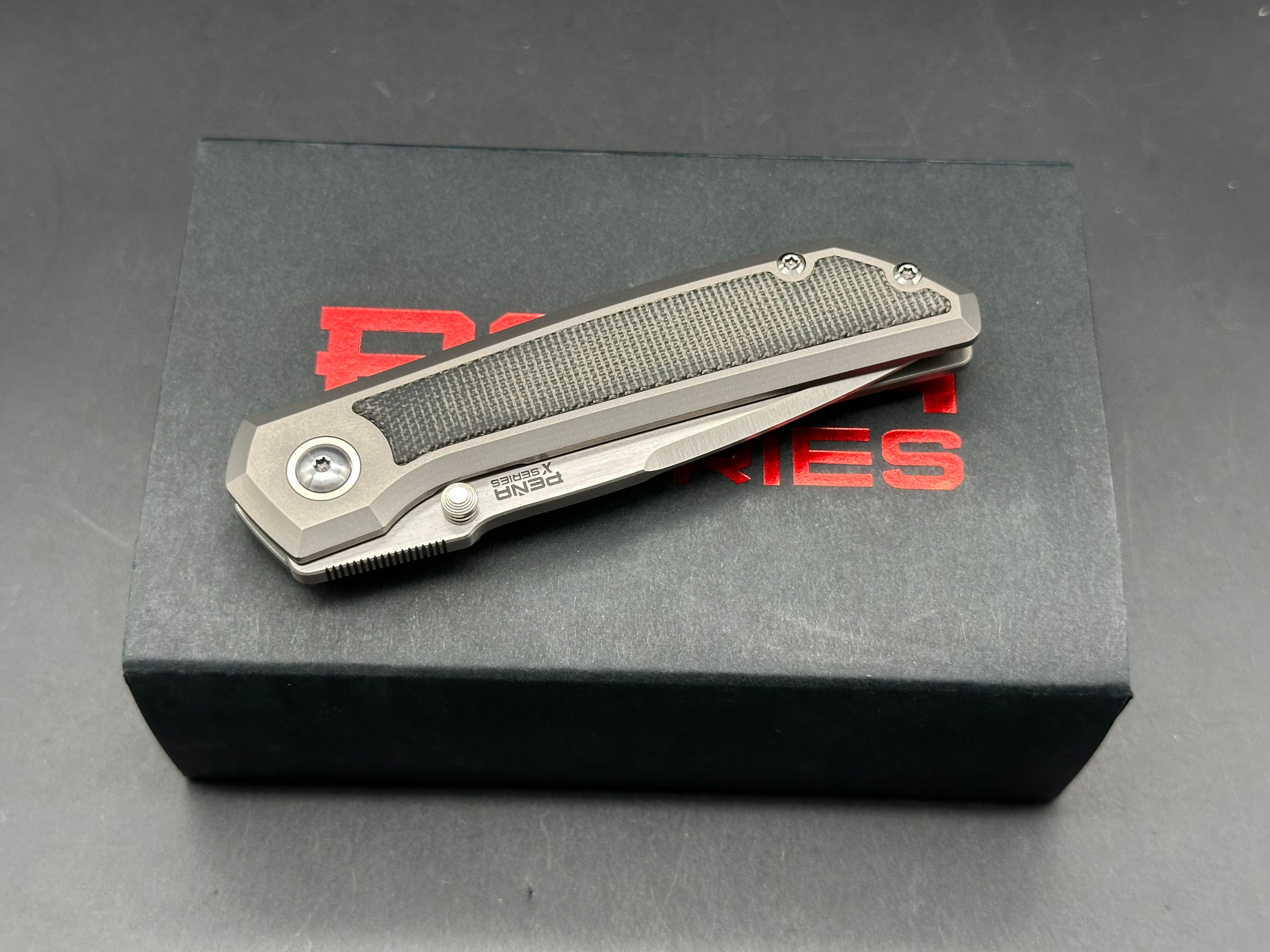 Pena X-Series Mula Drop Point, Belt Satin M390 Blade, Titanium Handles with Black Micarta Inlays