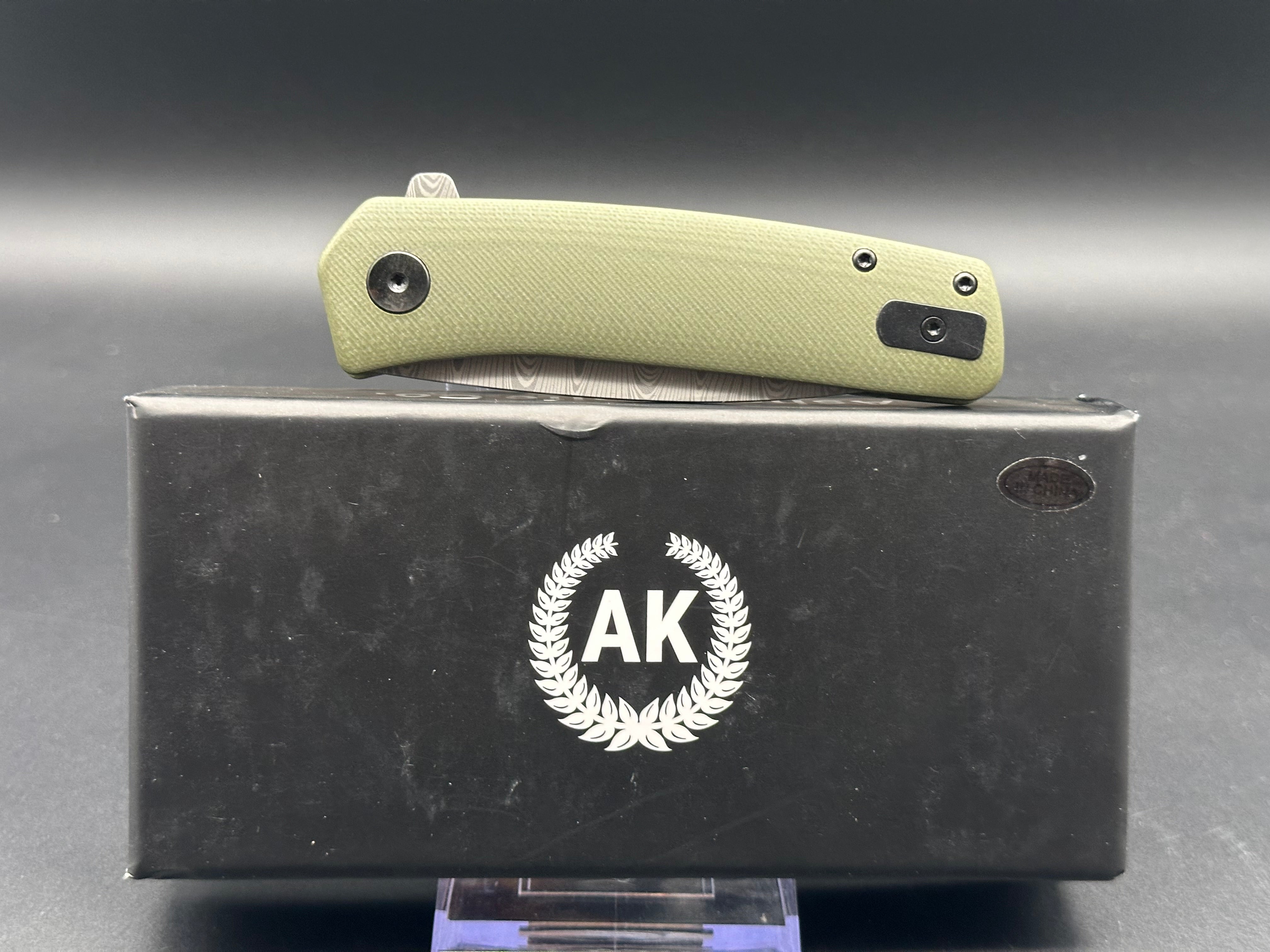 Asher Knives The Spiro flipper OD green G10 S35VN LNIB - blem Lasered ladder damascus
