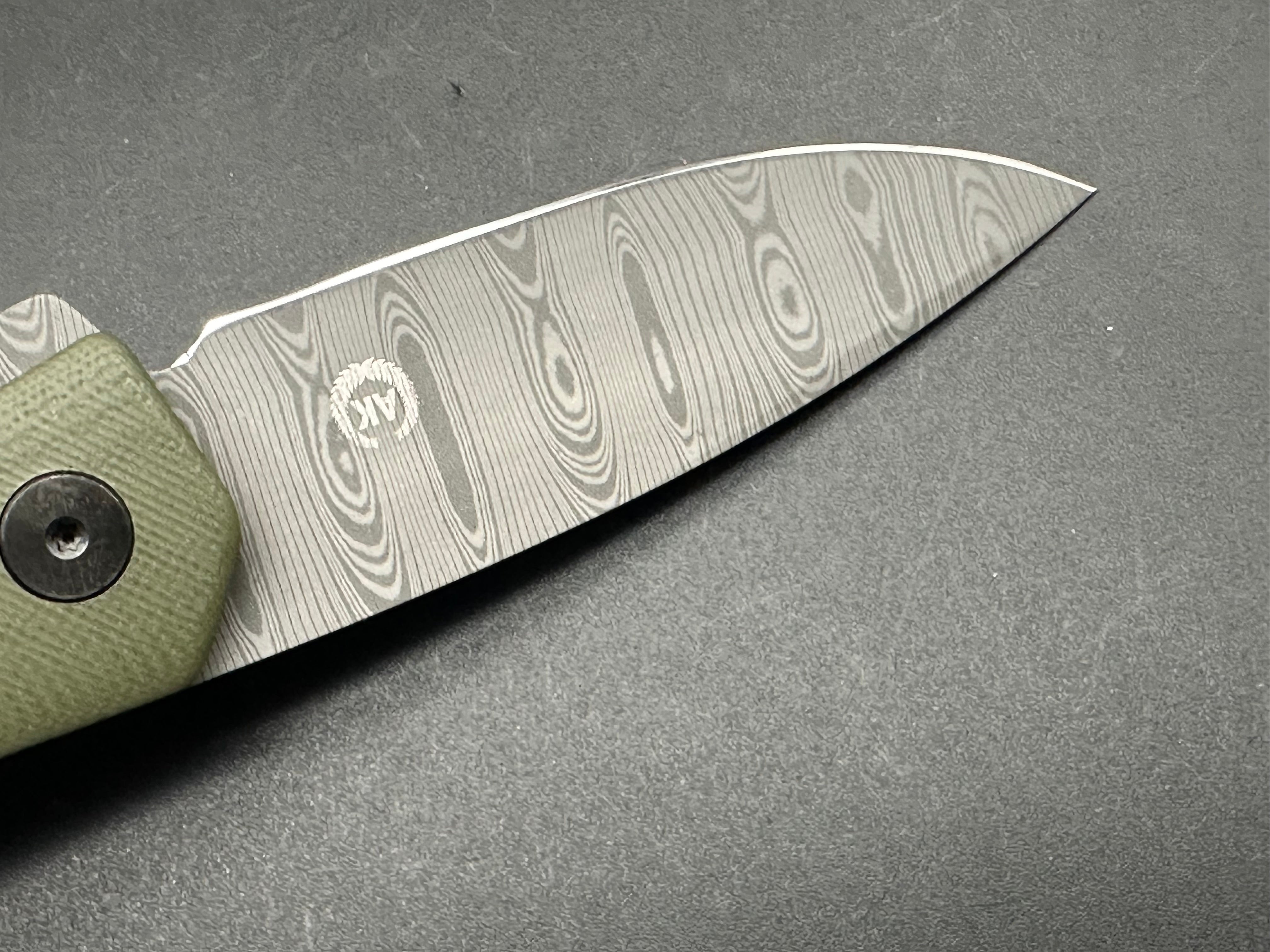 Asher Knives The Spiro flipper OD green G10 S35VN LNIB - blem Lasered ladder damascus