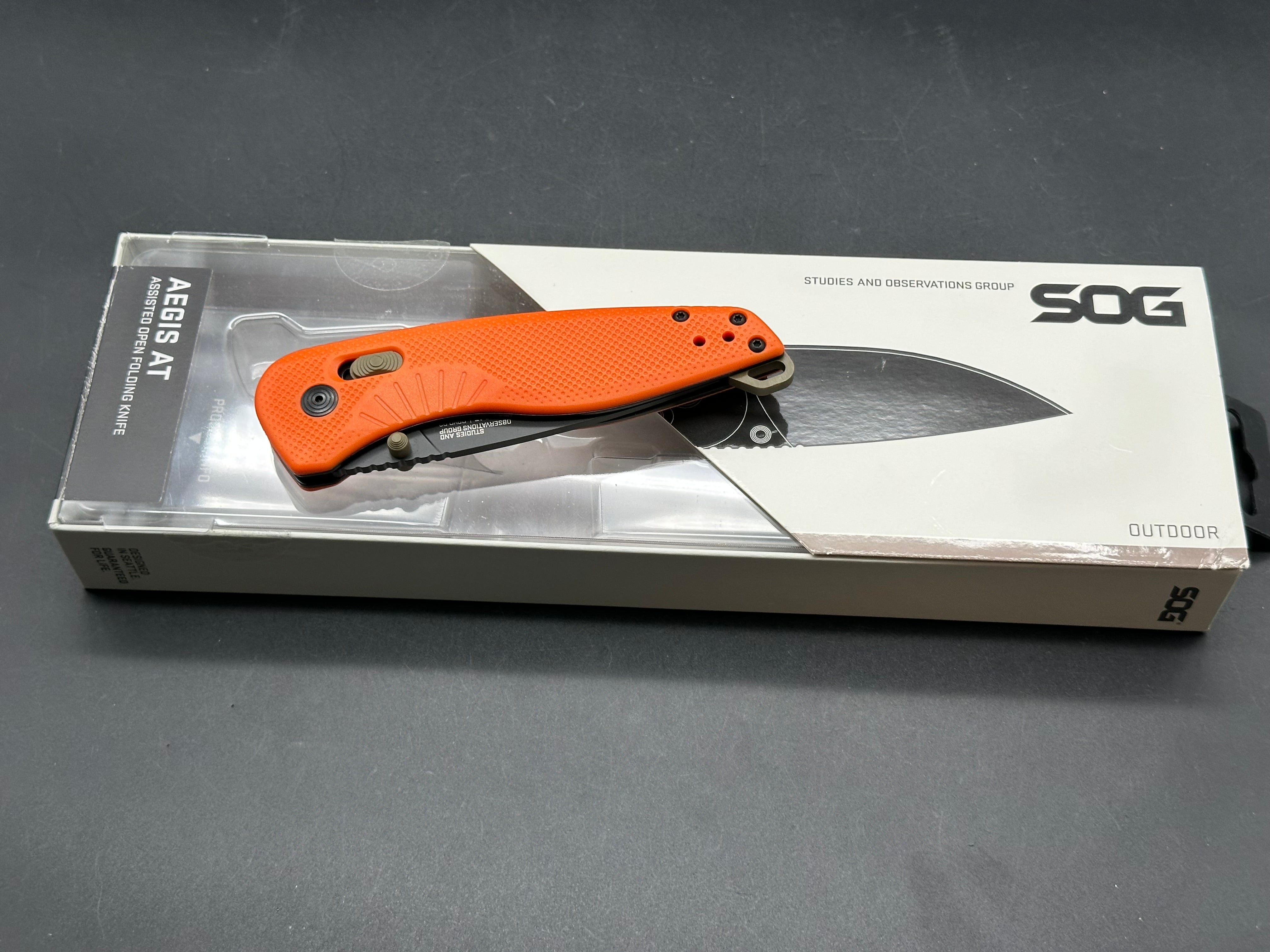 SOG Aegis AT Blaze and Tan Assisted Folding Knife 3.13" D2 Black Plain Blade, Orange GRN Handles