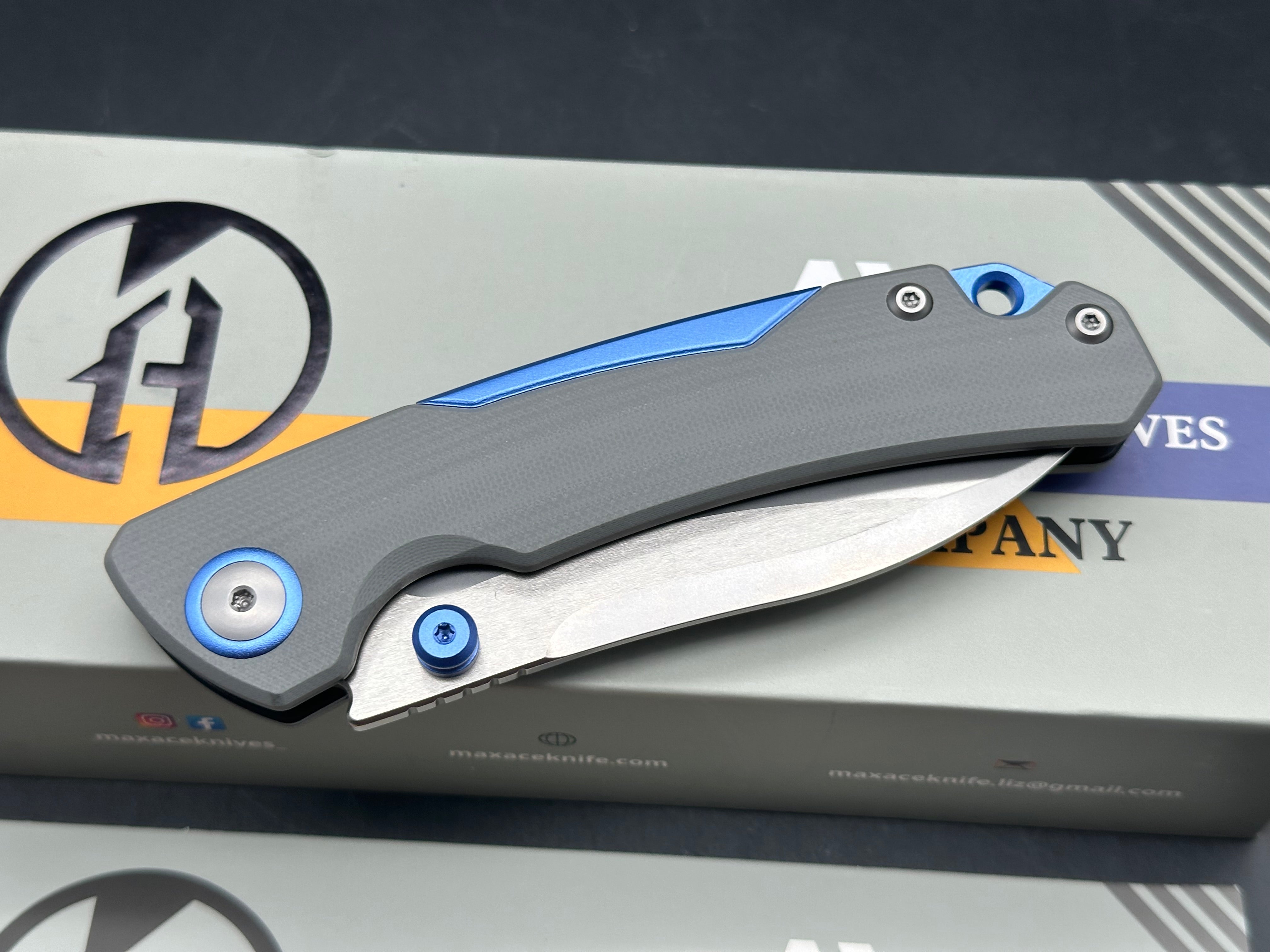 Maxace Toucan grey G10 and 10CR15COMOV blue aluminum spacer