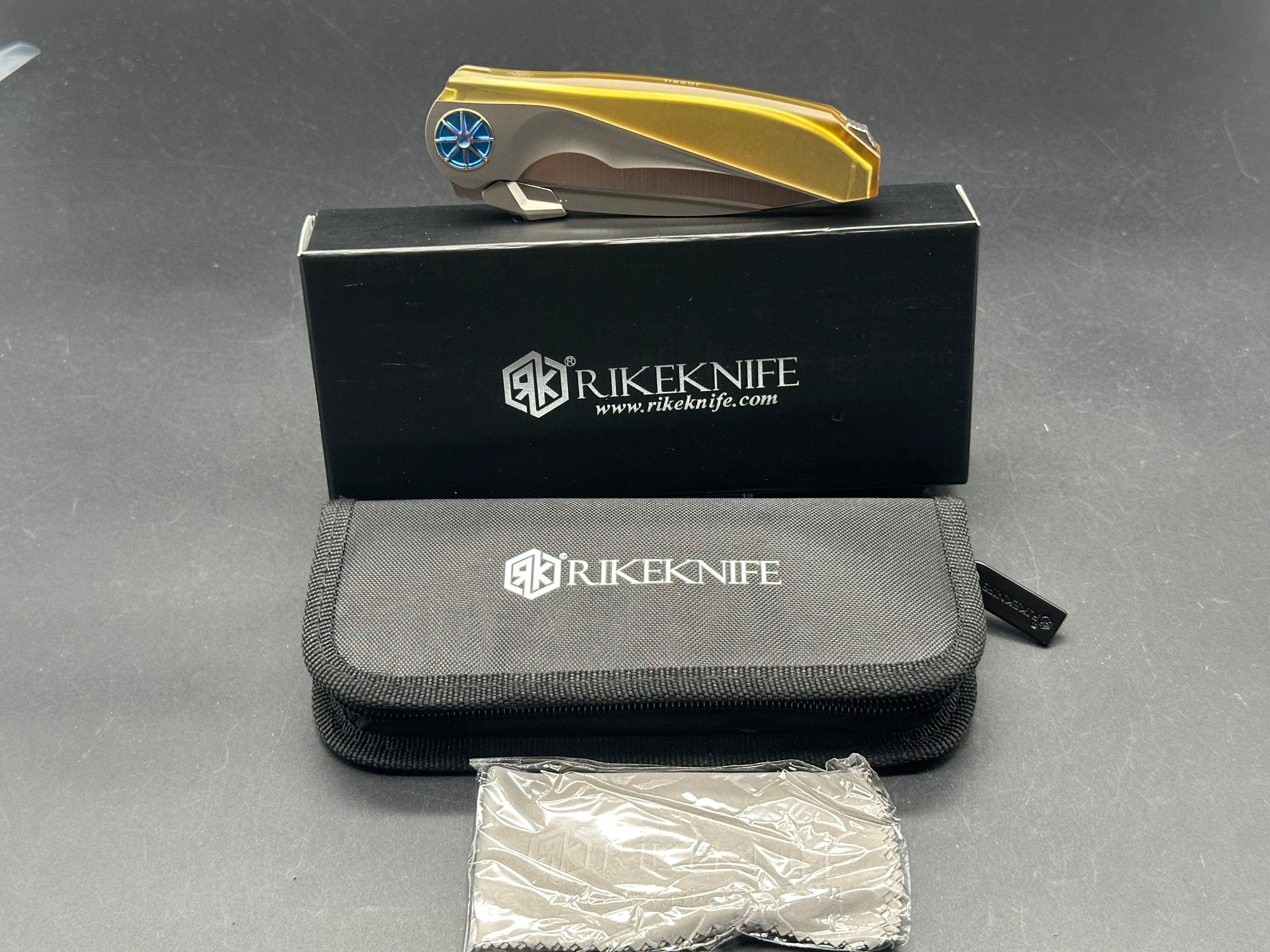 Rike Knife - Tissot V1/Grey Interlocking Integral Overshell Ti Frame + Blue Ano Gear Pivot/Drop Point/Satin M390