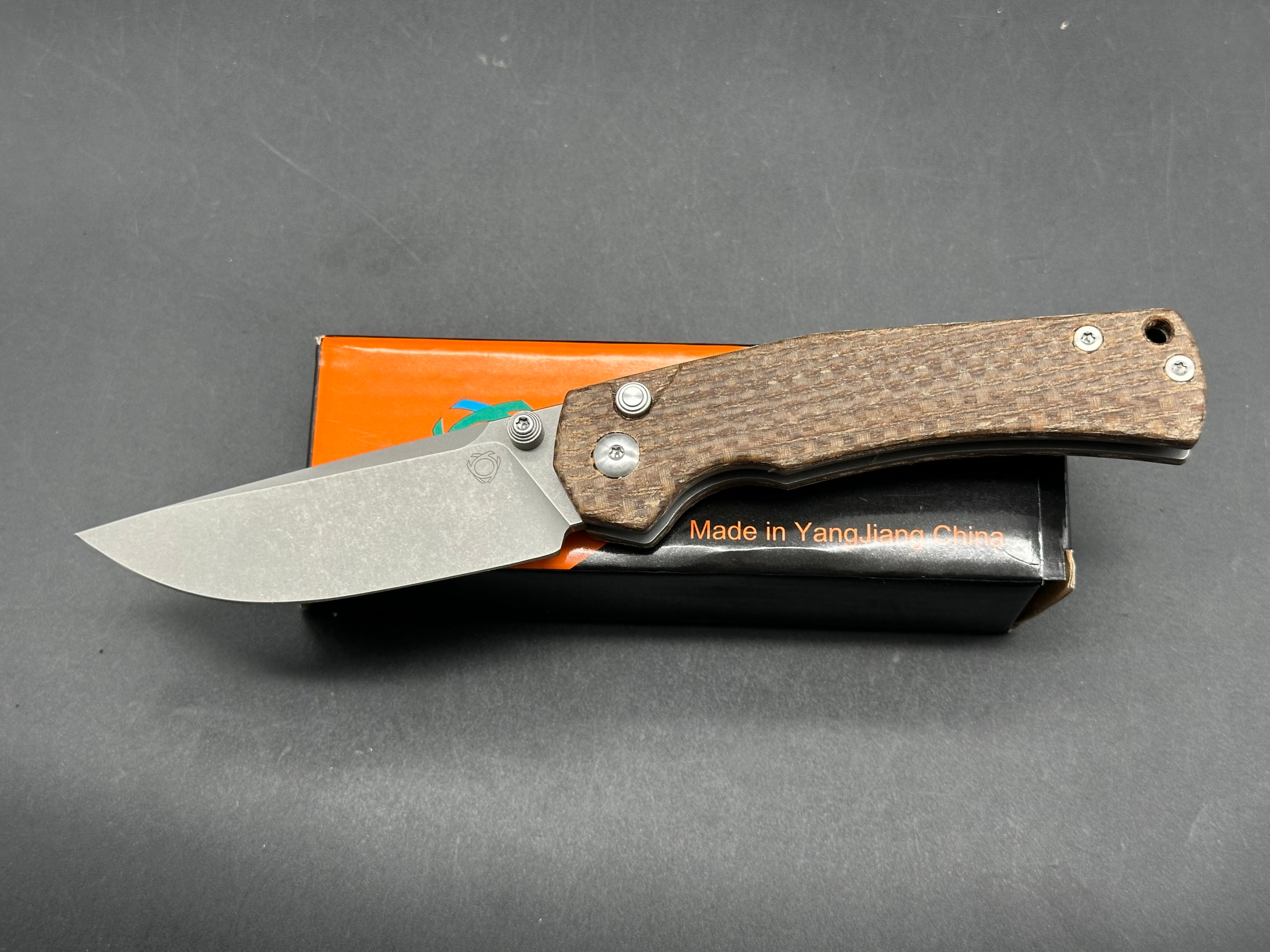 Sixleaf SL-18 Rattlesnake design, button lock, micarta scales, D2 blade