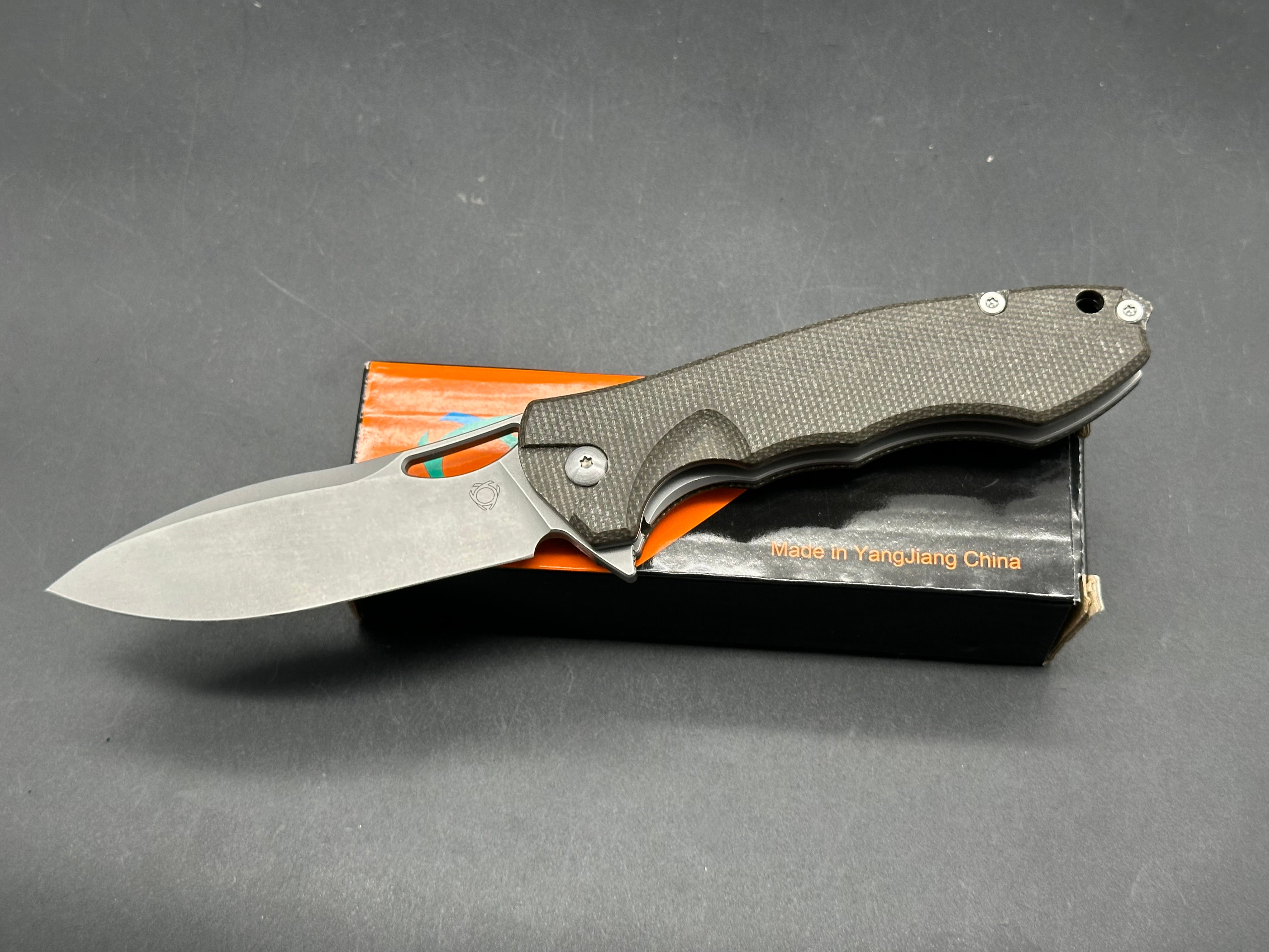 Sixleaf SL-20 Rattlesnake design, liner lock, micarta scales, D2 blade