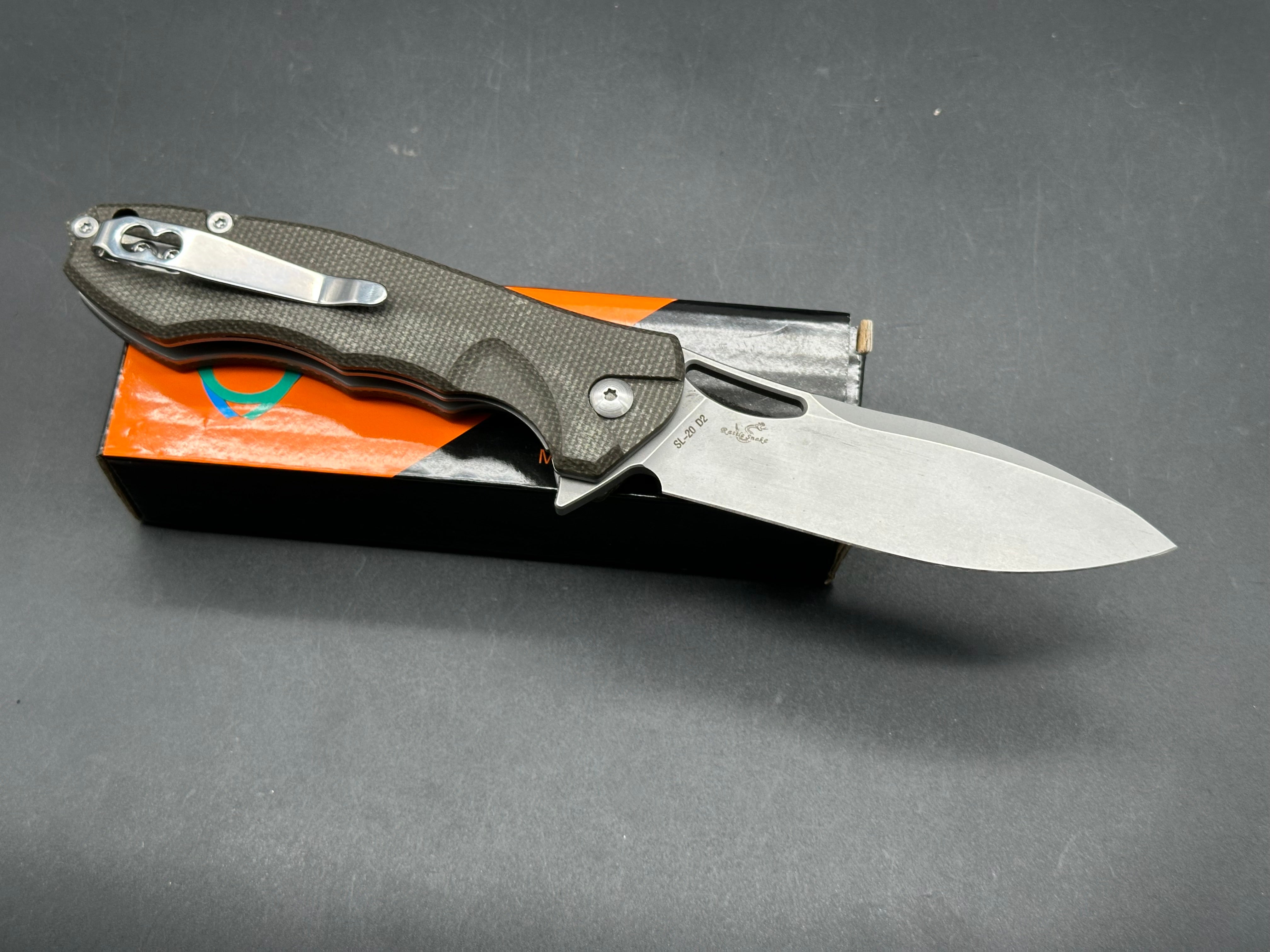 Sixleaf SL-20 Rattlesnake design, liner lock, micarta scales, D2 blade