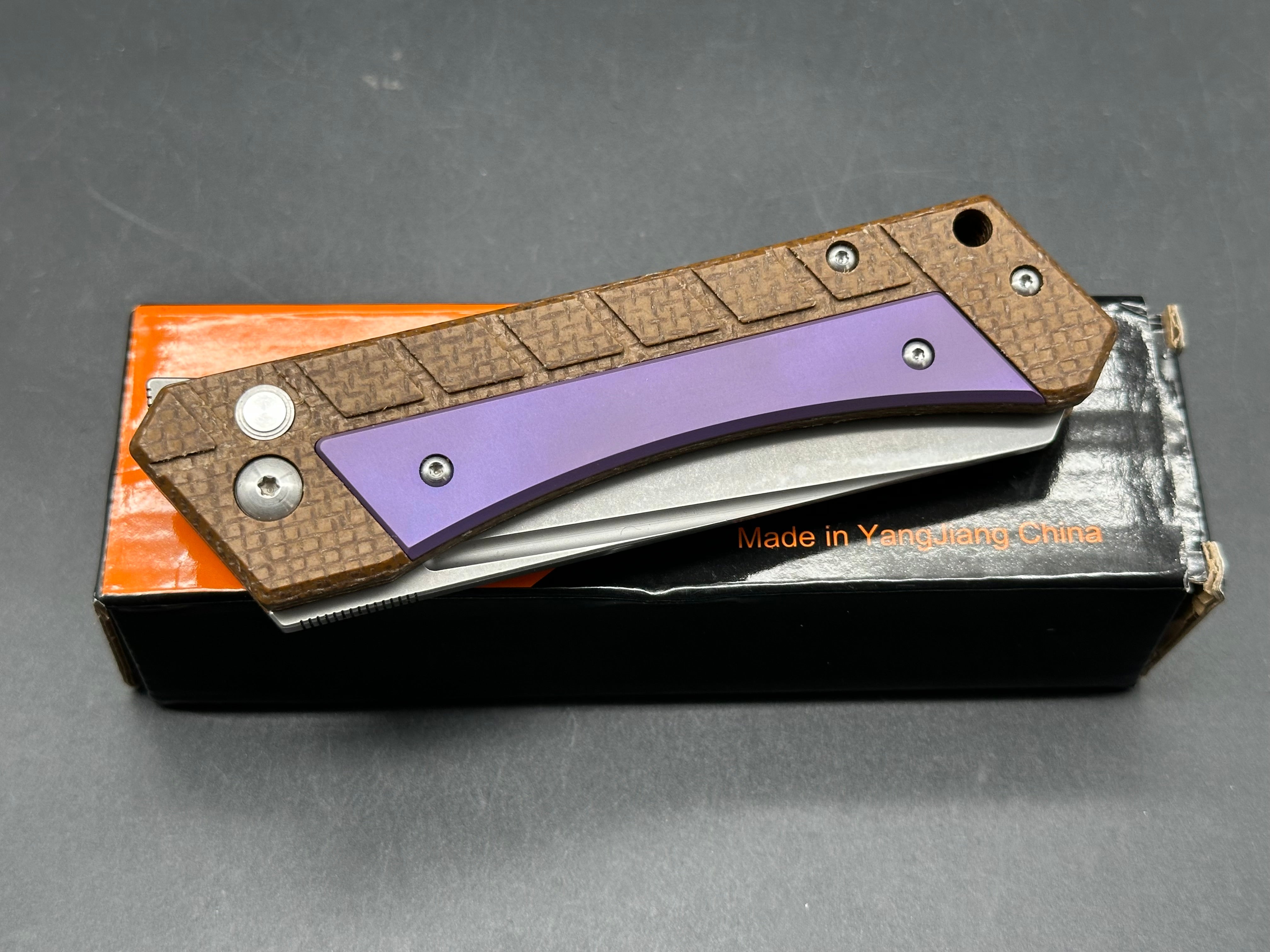 Sixleaf SL-22 PR Rattlesnake design, button lock, micarta scales with purple titanium inserts and pocket clip, 154-CM blade