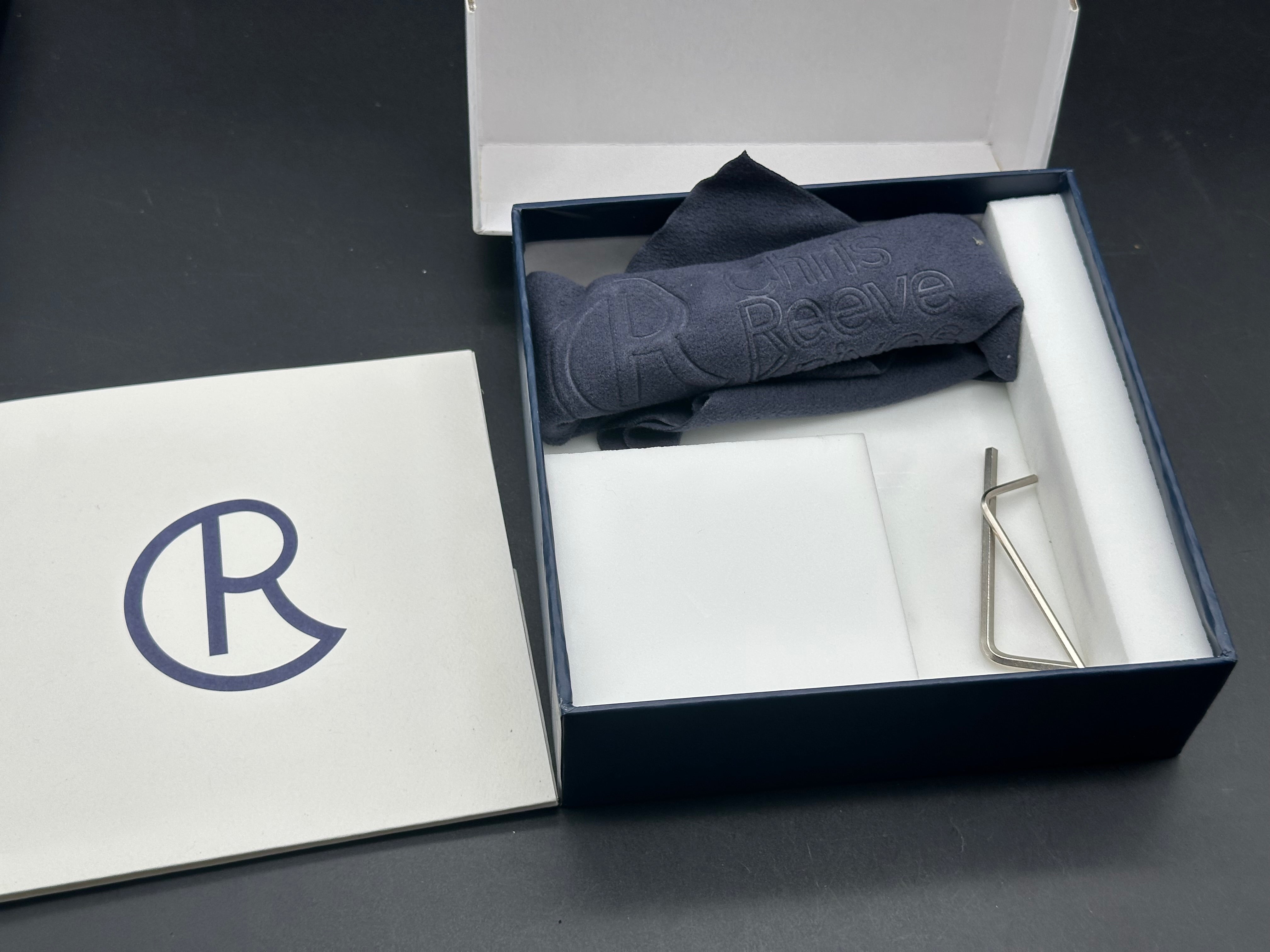 CRK Small Inkosi S35V plain Jane drop point user with snail trails