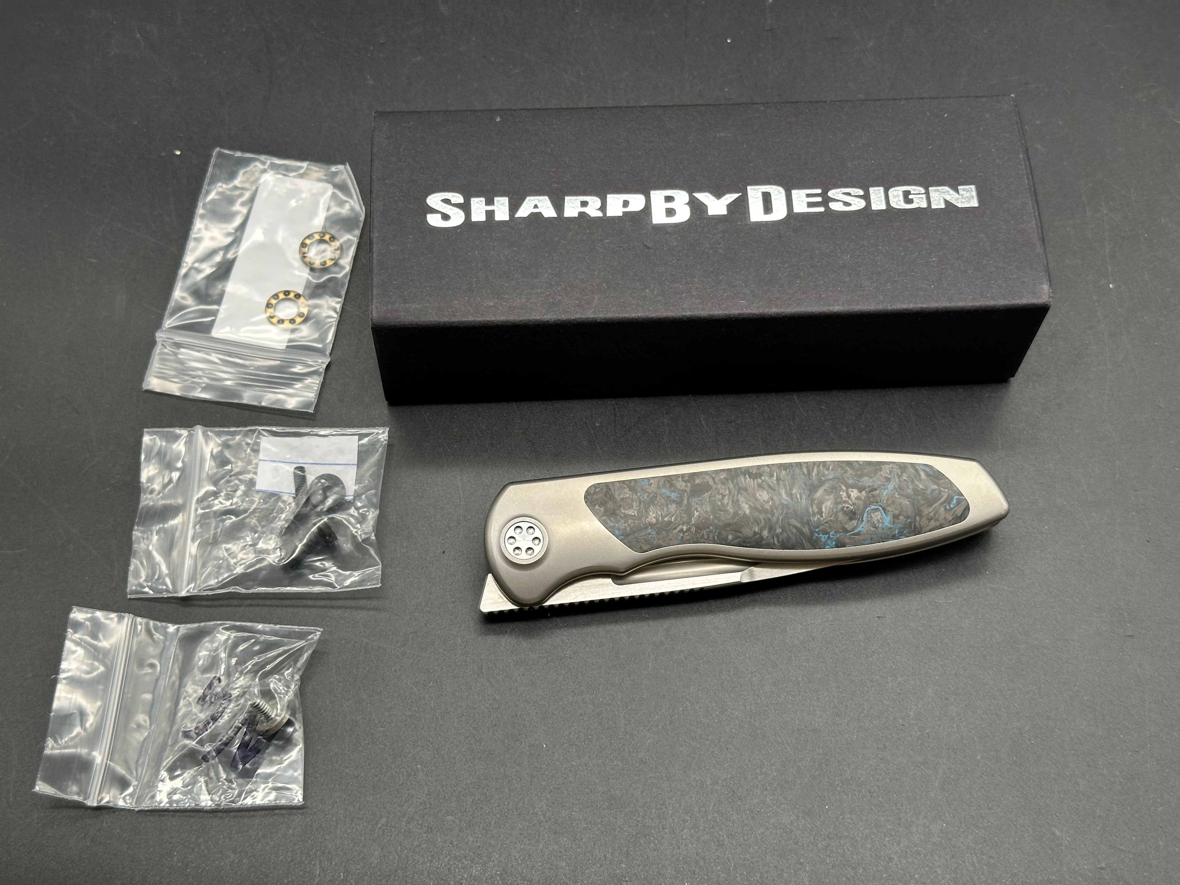 Sharp by Design, Mini Tempest, drop point, blue fat carbon, Skiff bearings