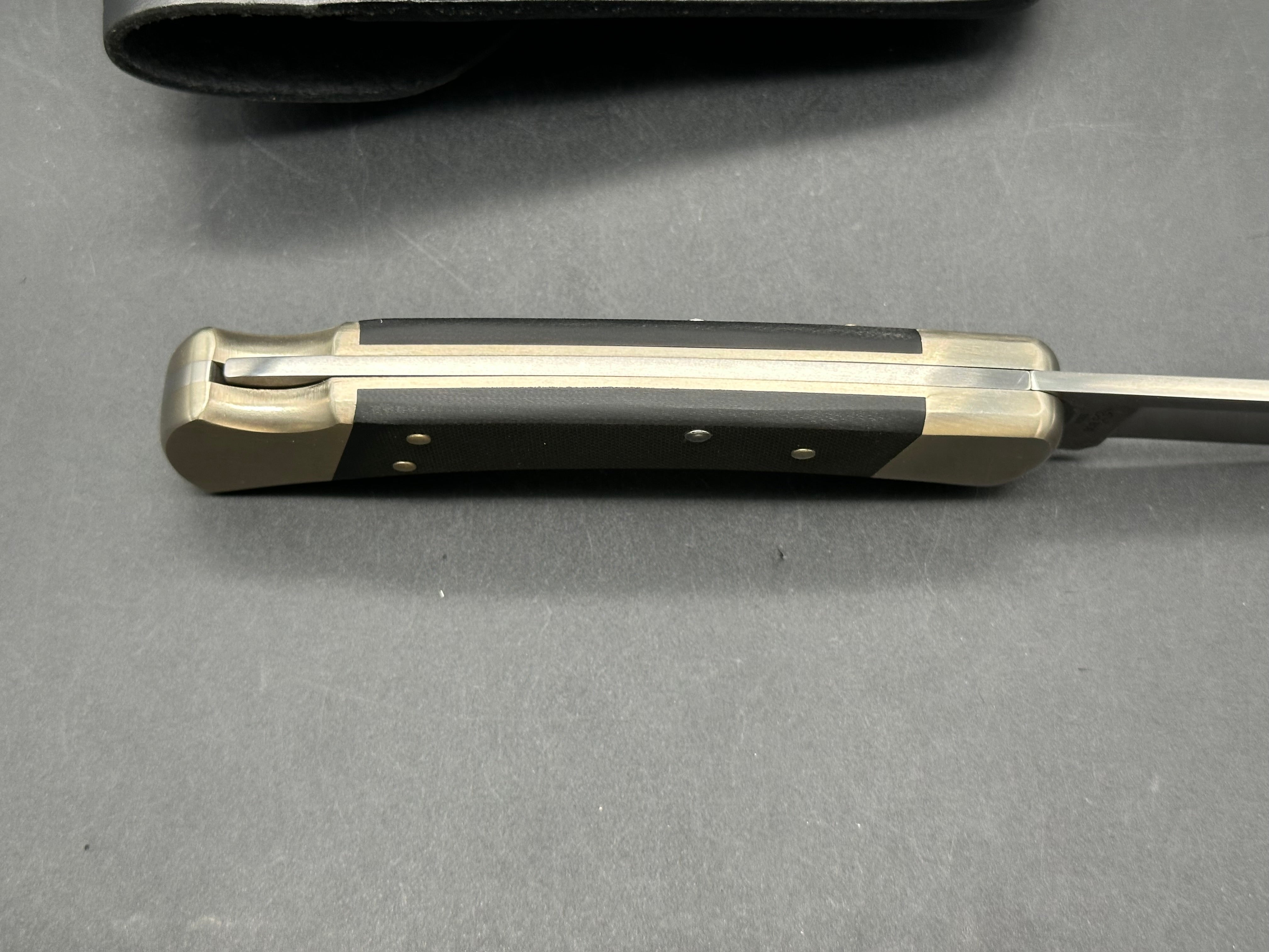 Buck 110 Auto, black G-10 scales, nickel bolsters, with scabbard