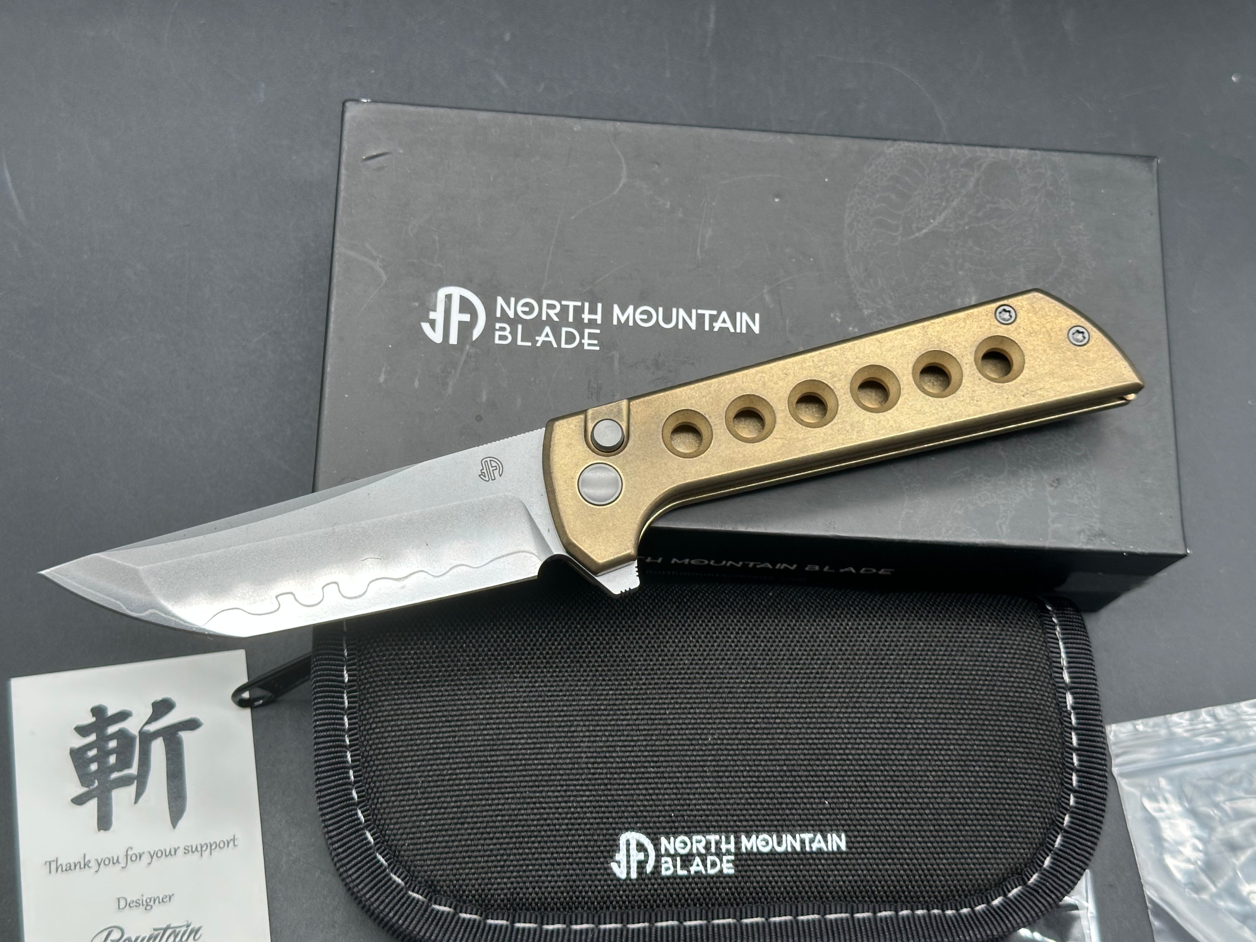 North Mountain Blade Chop 2 Button Lock Flipper Knife 3.5" SLD Hamon Drop Point Blade, Aluminum Bronze Handles with Speed Holes