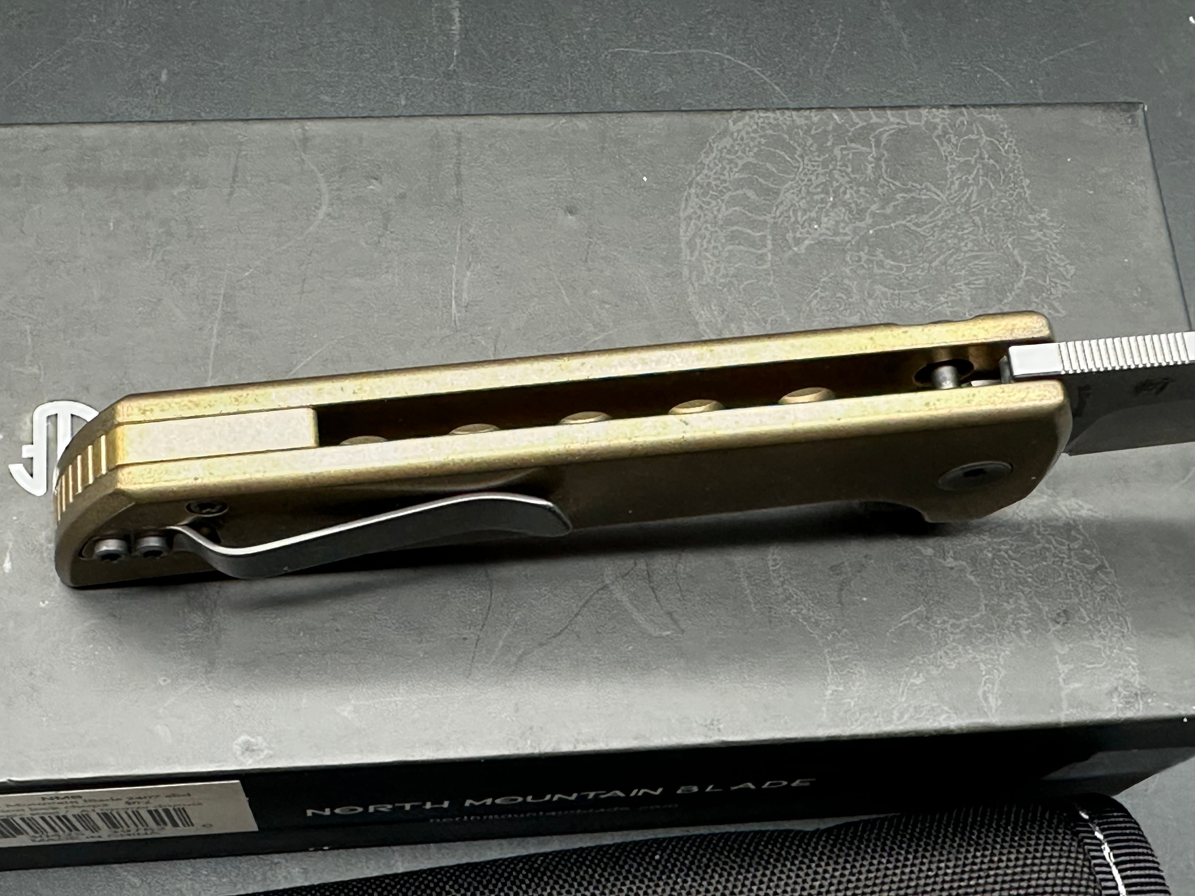 North Mountain Blade Chop 2 Button Lock Flipper Knife 3.5" SLD Hamon Drop Point Blade, Aluminum Bronze Handles with Speed Holes