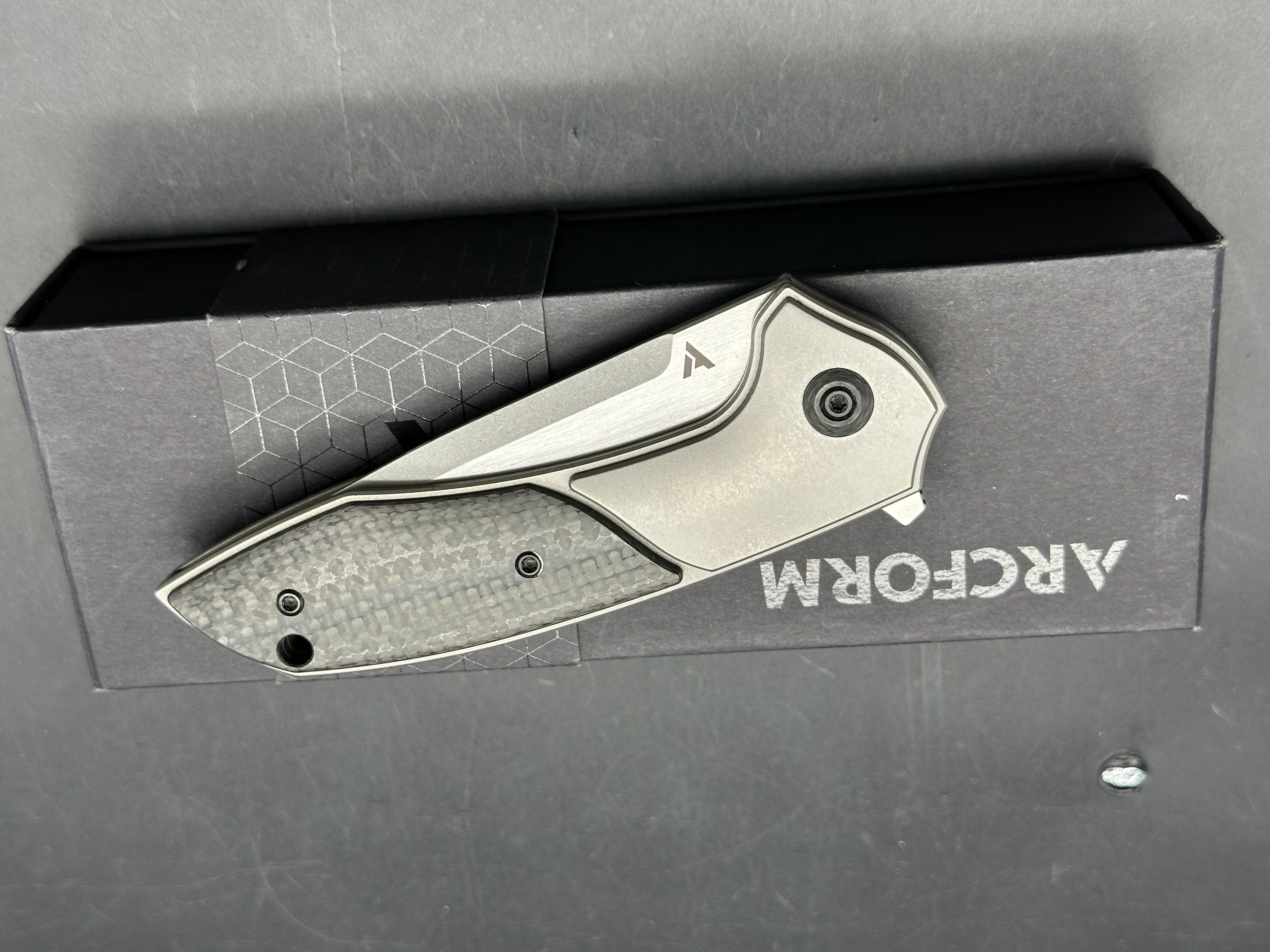 Arcform Catalyst: Geoff Blauvelt design. 3.5 inch CPM-S35VN blade. Frame lock. Titanium and carbon fiber handle