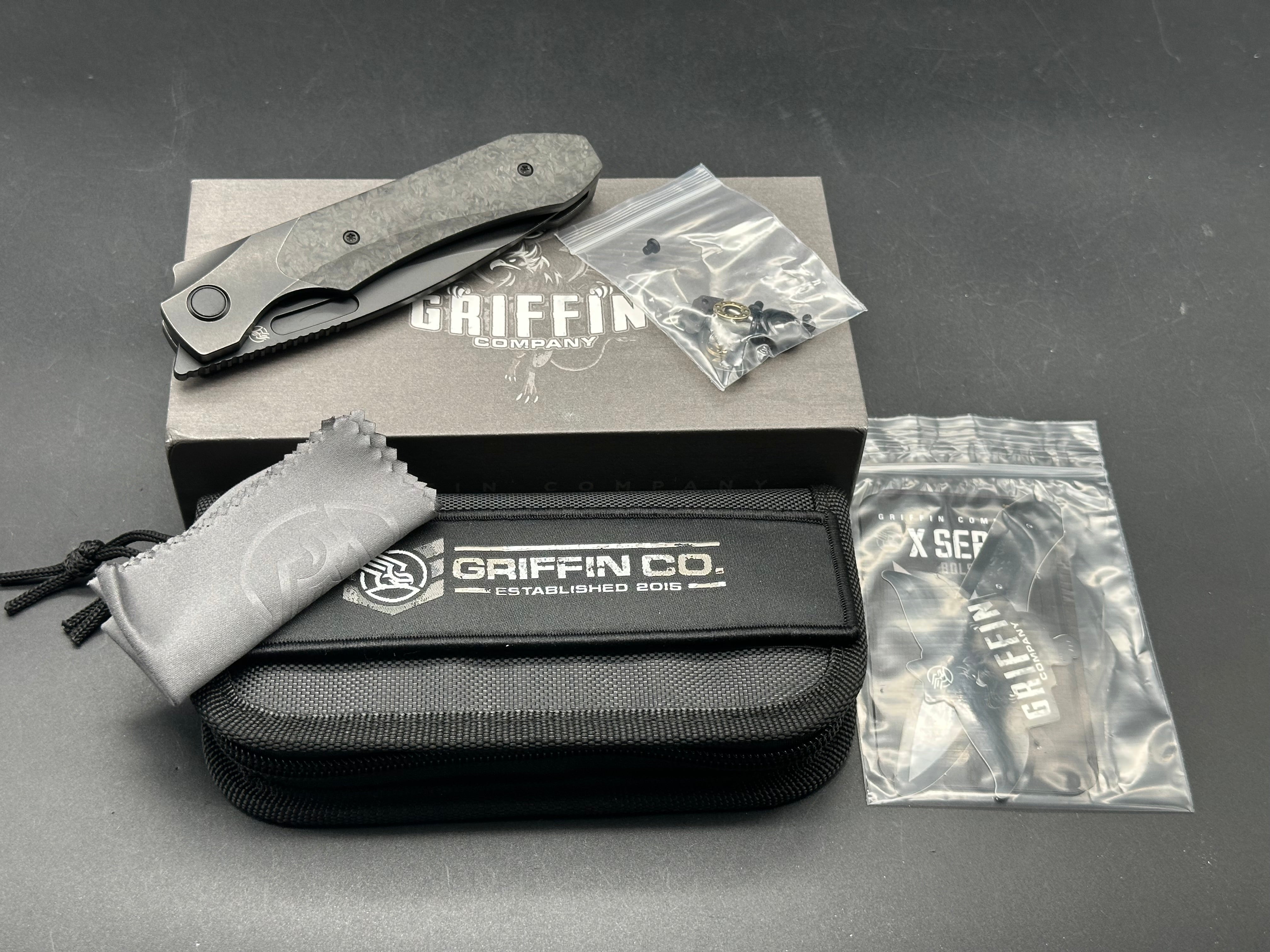 Griffin Company X Series Bolster Lock, Blackwashed CPM Magnacut Blade, Blackwashed Ti Bolster Lock with Marbled Carbon Fiber