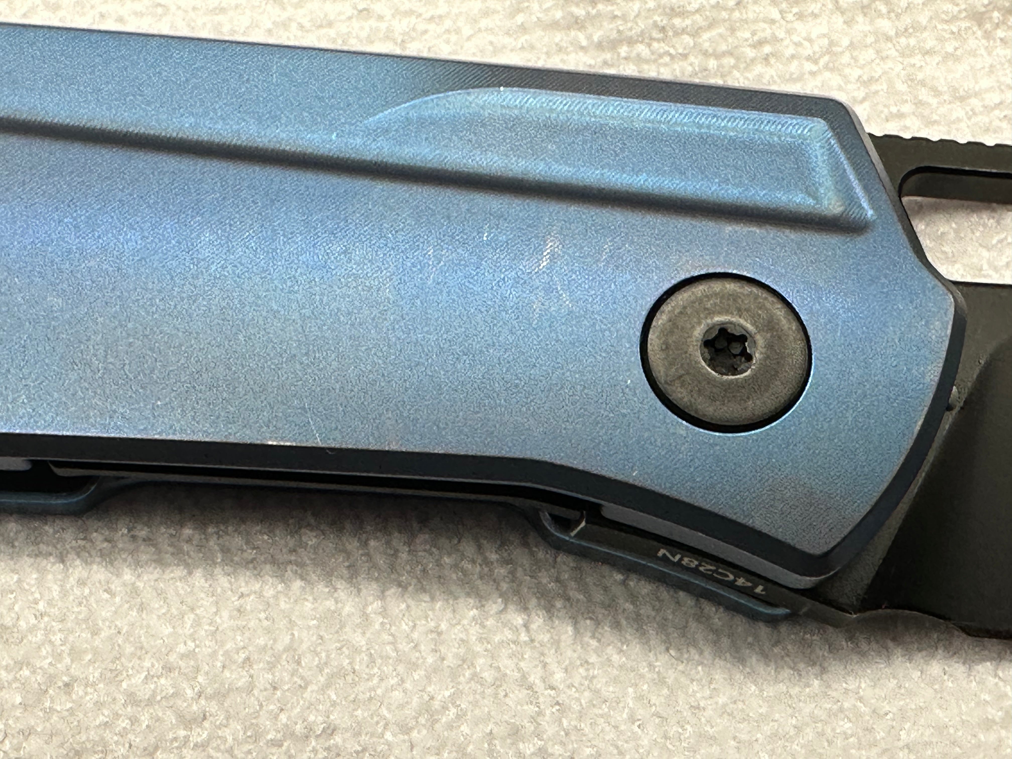 Divo Mash: 3.5 inch blackwashed 154CM blade. Blue anodized titanium frame. No clip