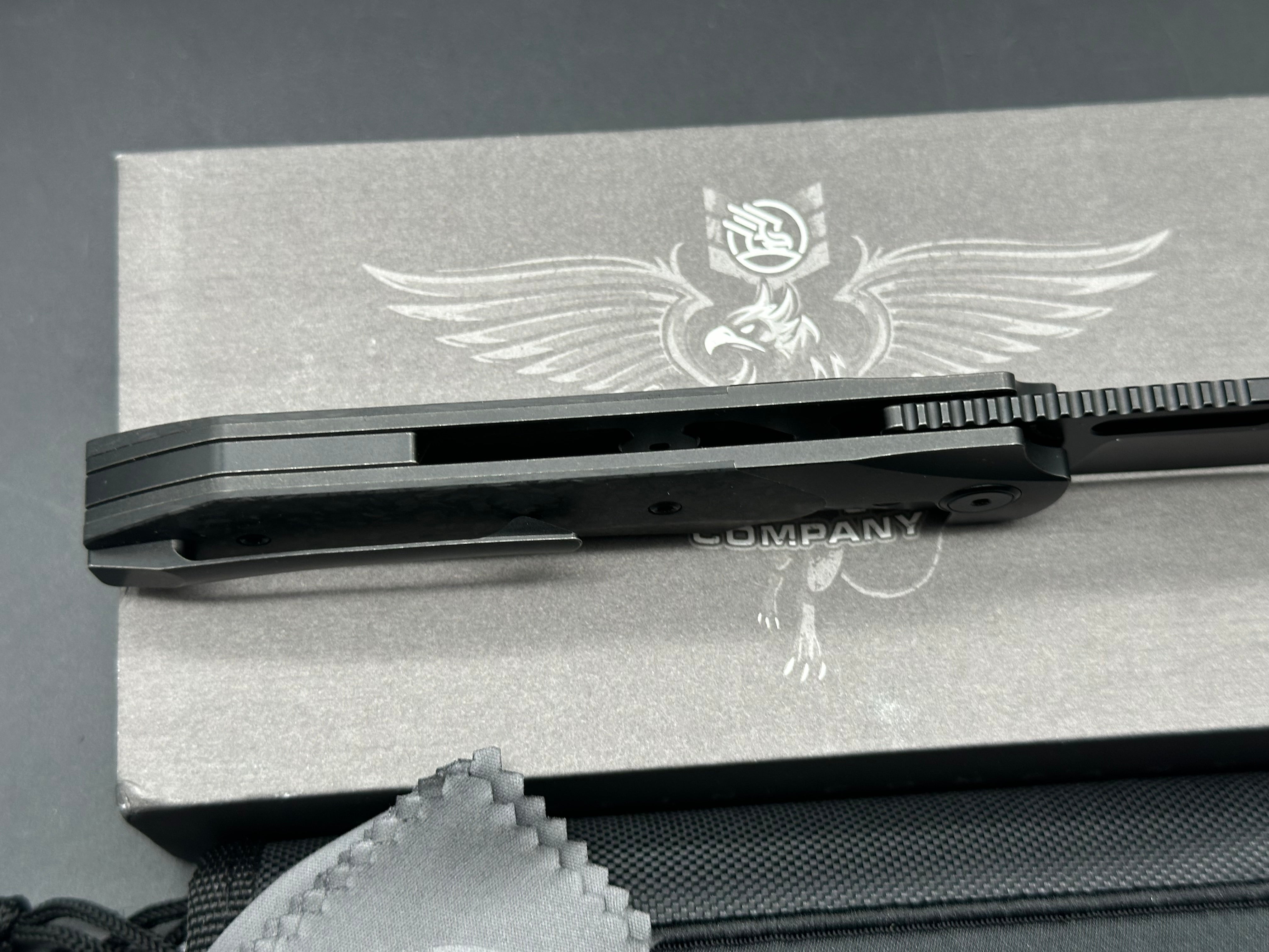 Griffin Company X Series Bolster Lock, Blackwashed CPM Magnacut Blade, Blackwashed Ti Bolster Lock with Marbled Carbon Fiber