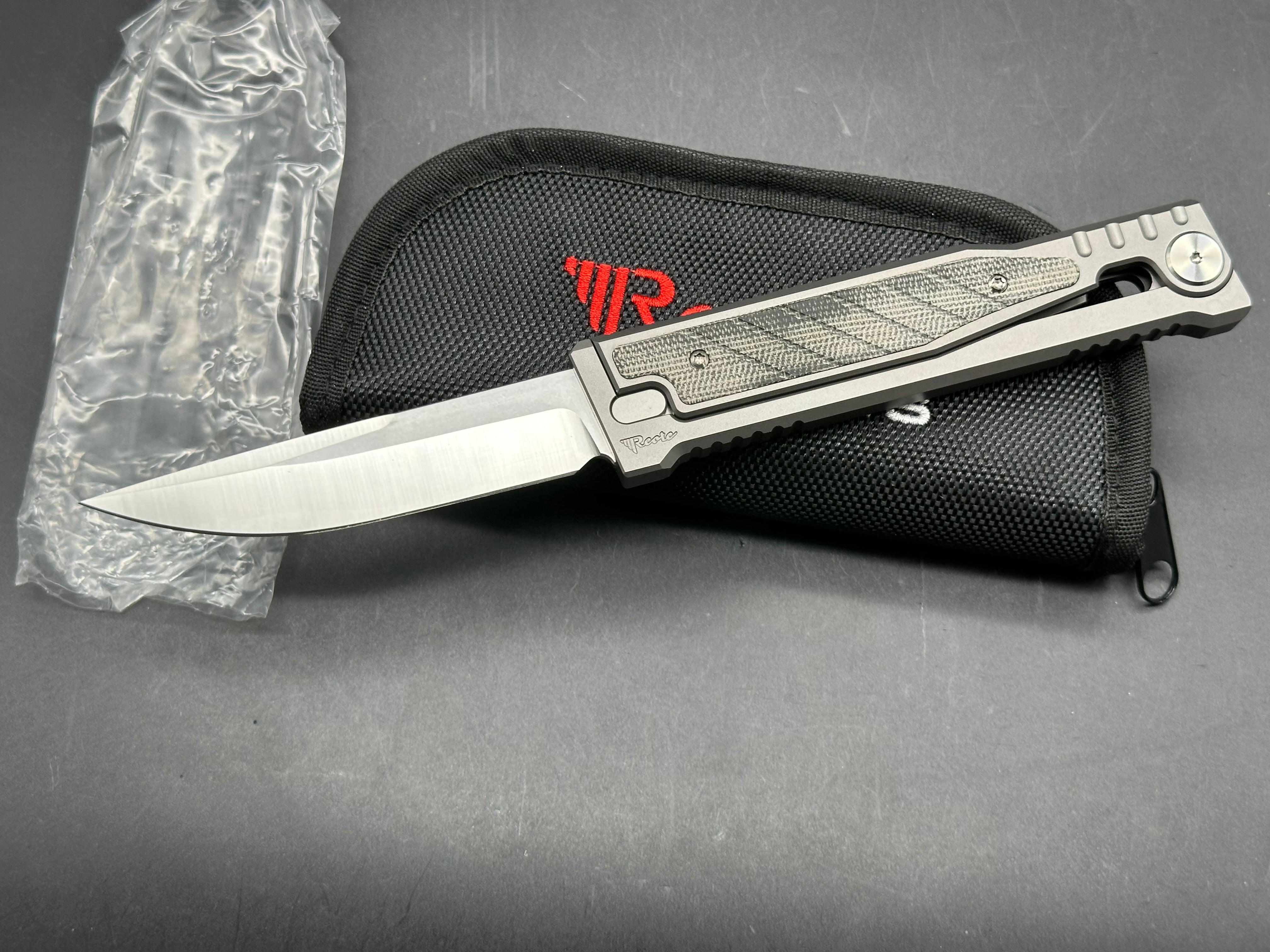 Reate Exo 3.75 inch Elmax gravity drop blade Titanium frame with green micarta inserts