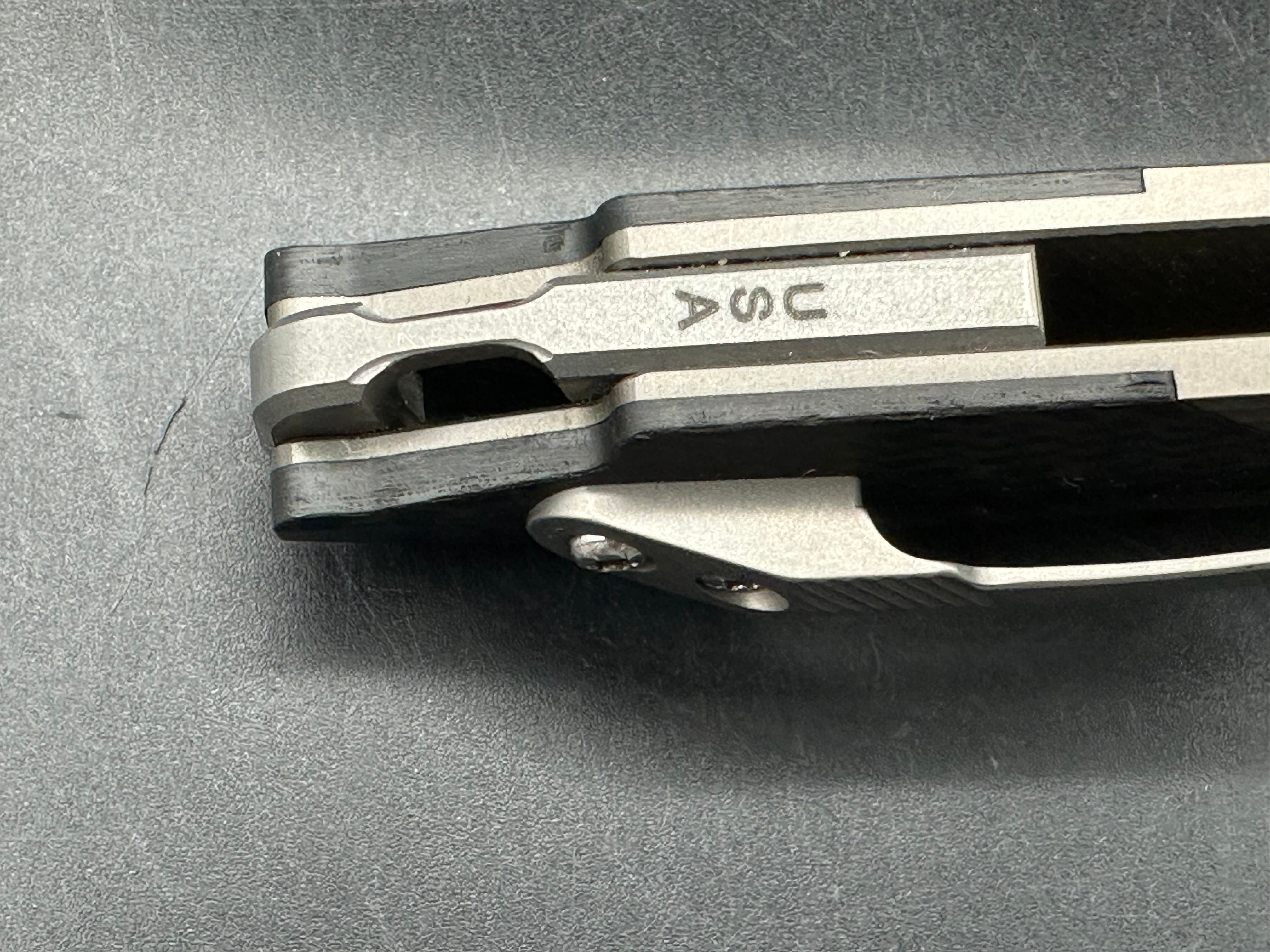 Spartan Blades Kranos 3.375 inch CPM-S35VN blade. Machined titanium handle with Spartan inspired carbon fiber inlays