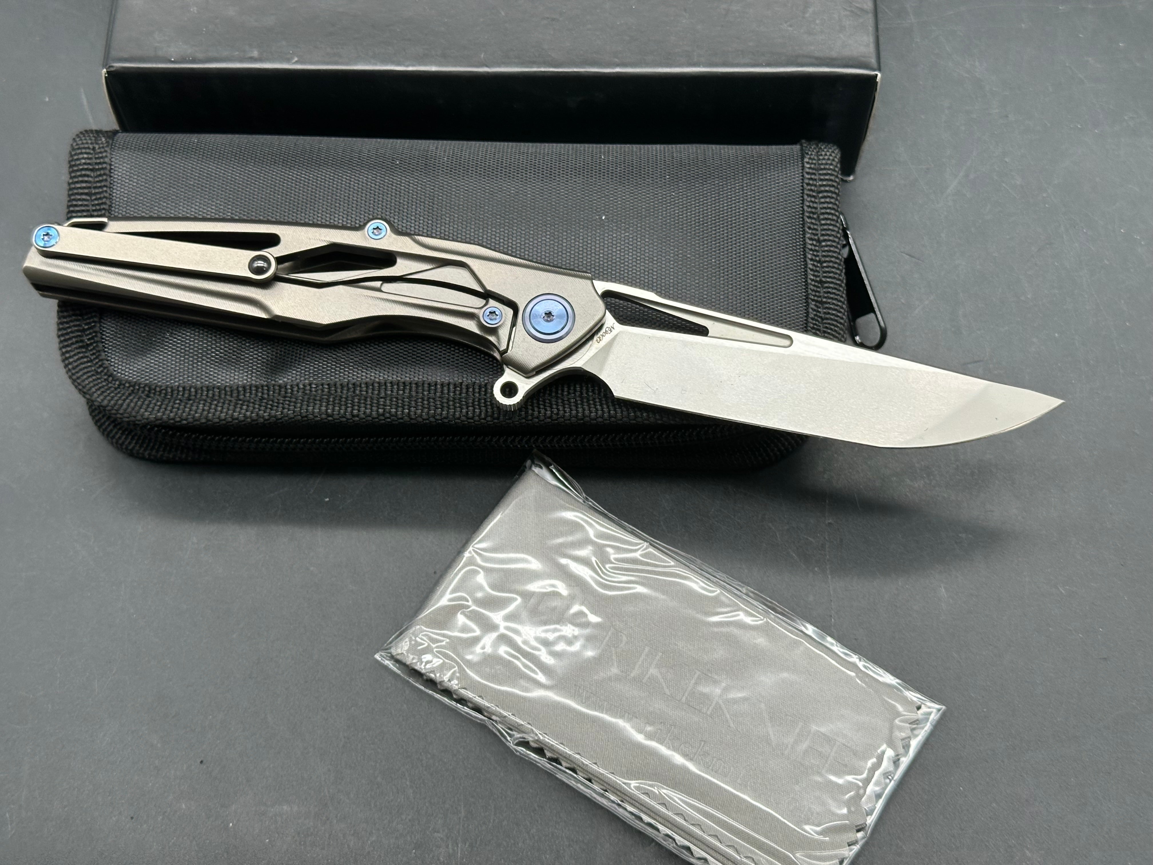 Rike Knives Knight 3.75 inch CPM-N690 tumbled, two tone blade. Titanium handle