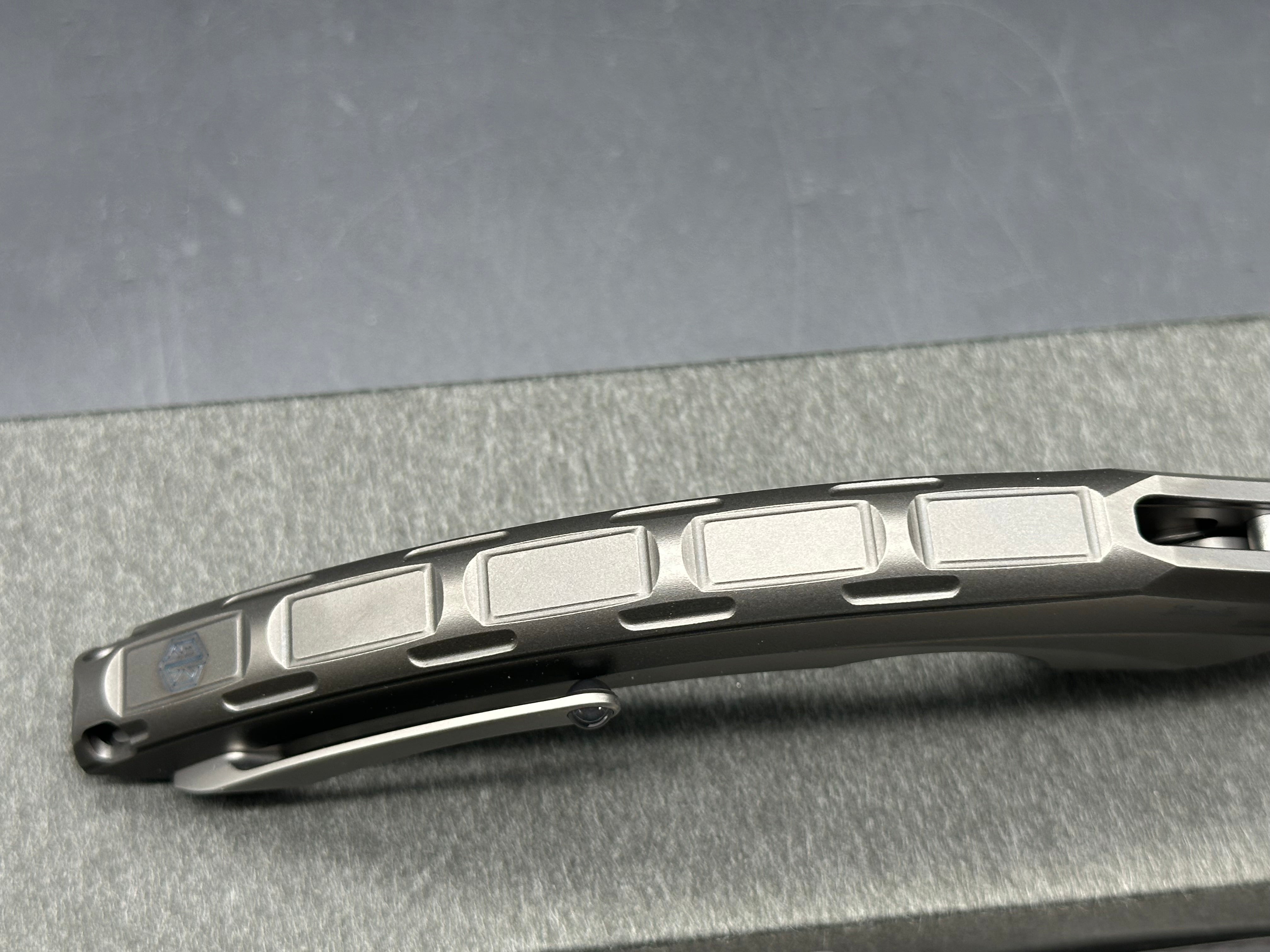 Rike Knives Lamella 3.75 inch CPM-20CV two tone blade with fullers. Titanium pseudo integral frame and liner