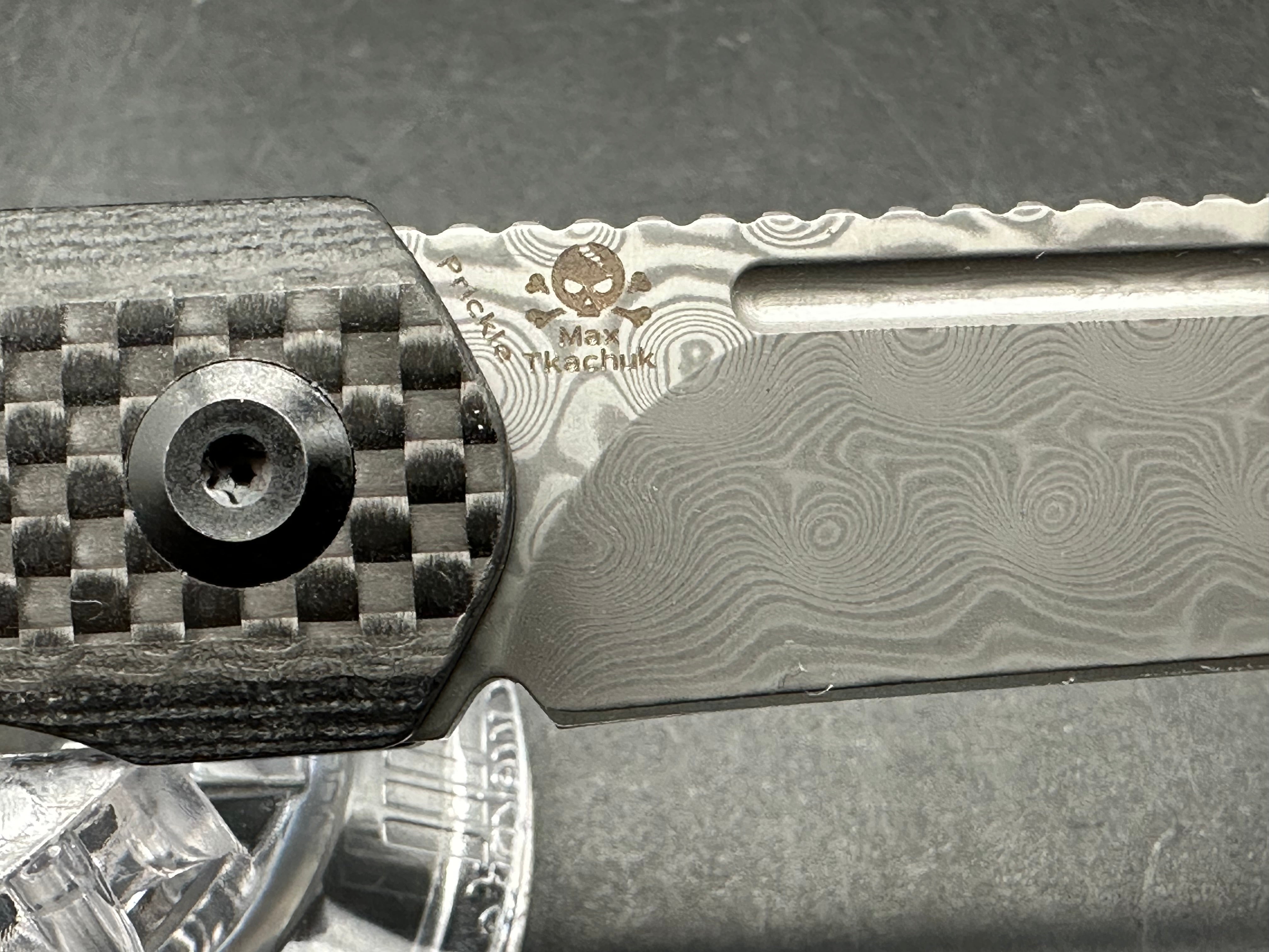Kansept Prickle 3.5 inch Damascus blade. Carbon fiber scales