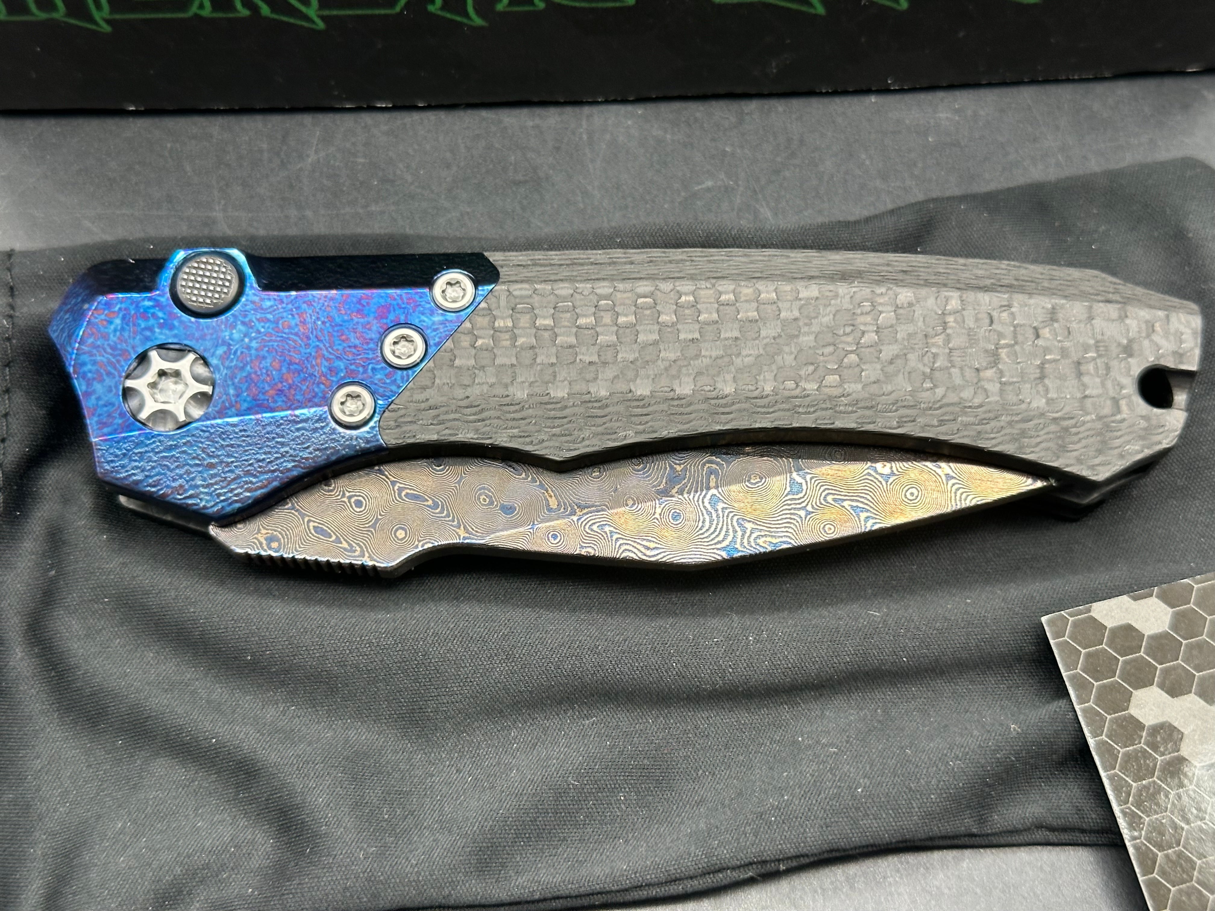 Heretic Wraith Integral Auto 3.75 inch clip point, polished and blued Vegas Forge Damascas blade
