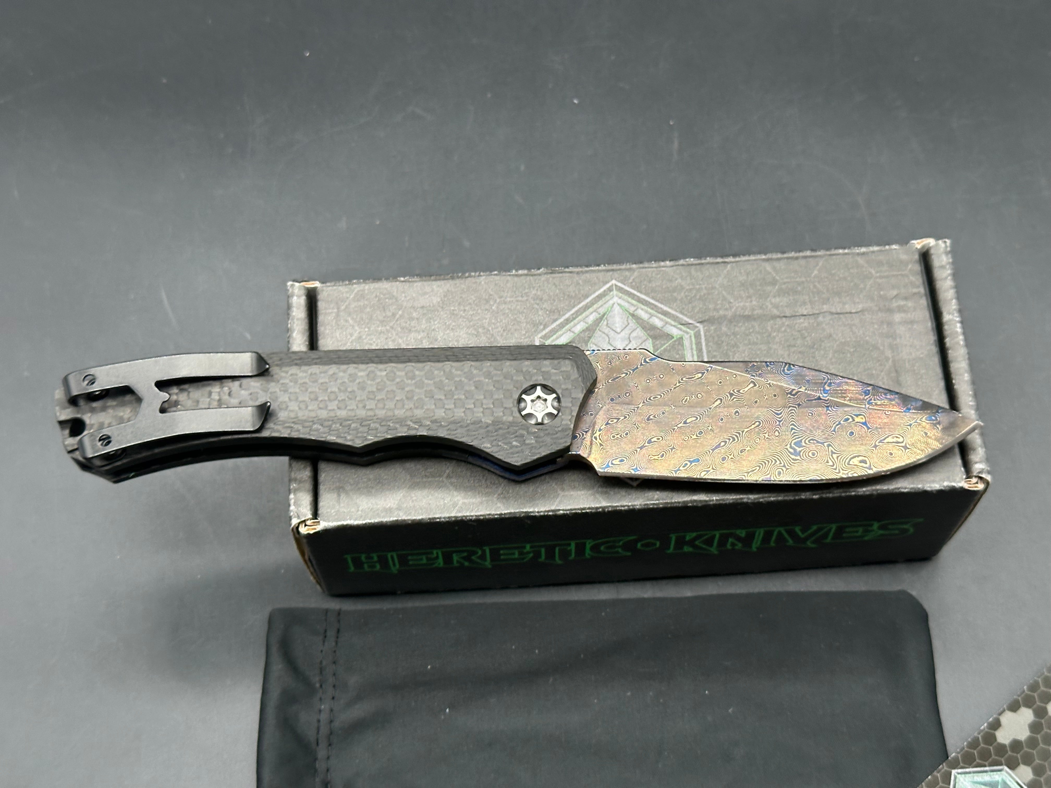 Heretic Wraith Integral Auto 3.75 inch clip point, polished and blued Vegas Forge Damascas blade