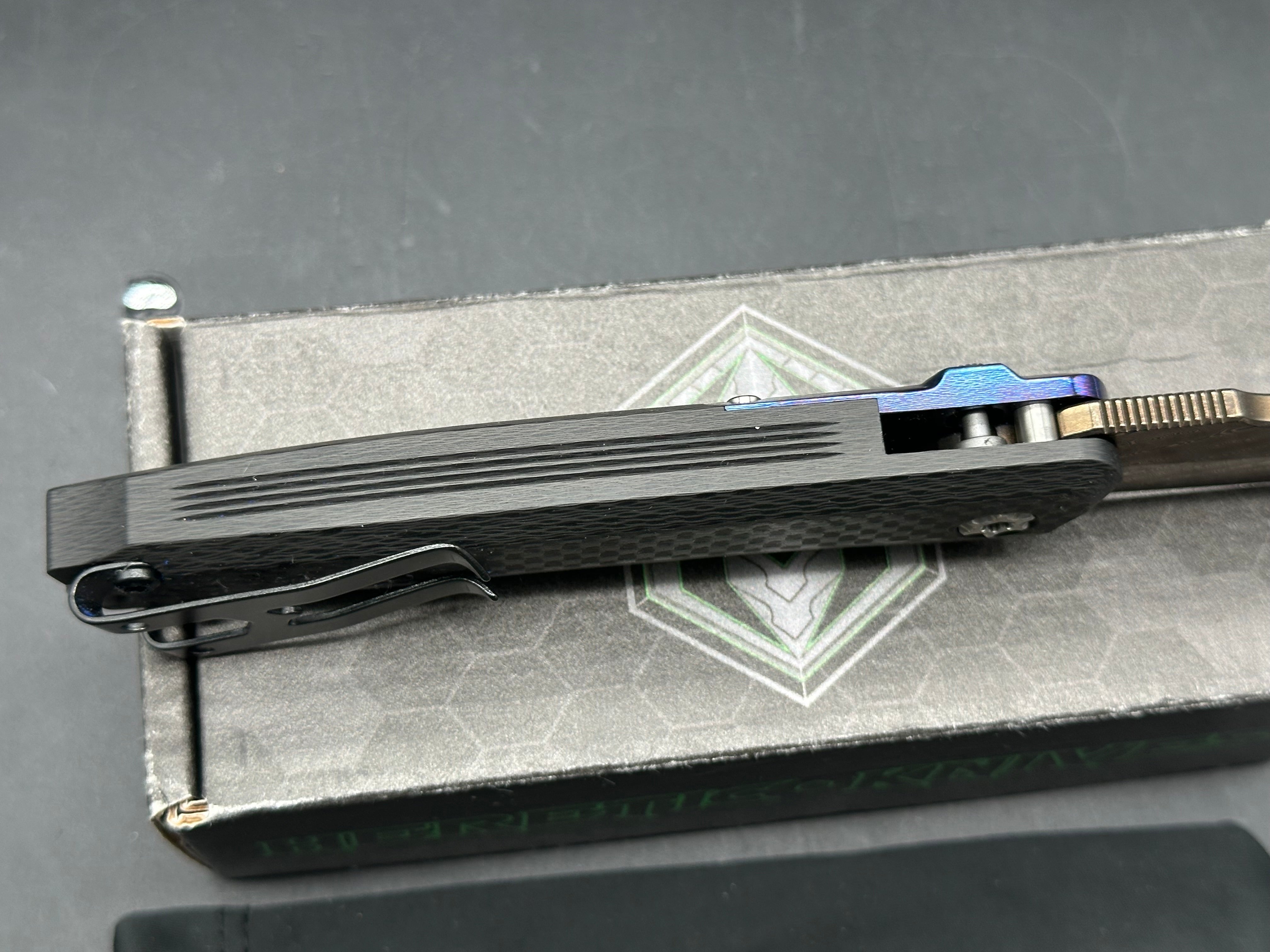 Heretic Wraith Integral Auto 3.75 inch clip point, polished and blued Vegas Forge Damascas blade