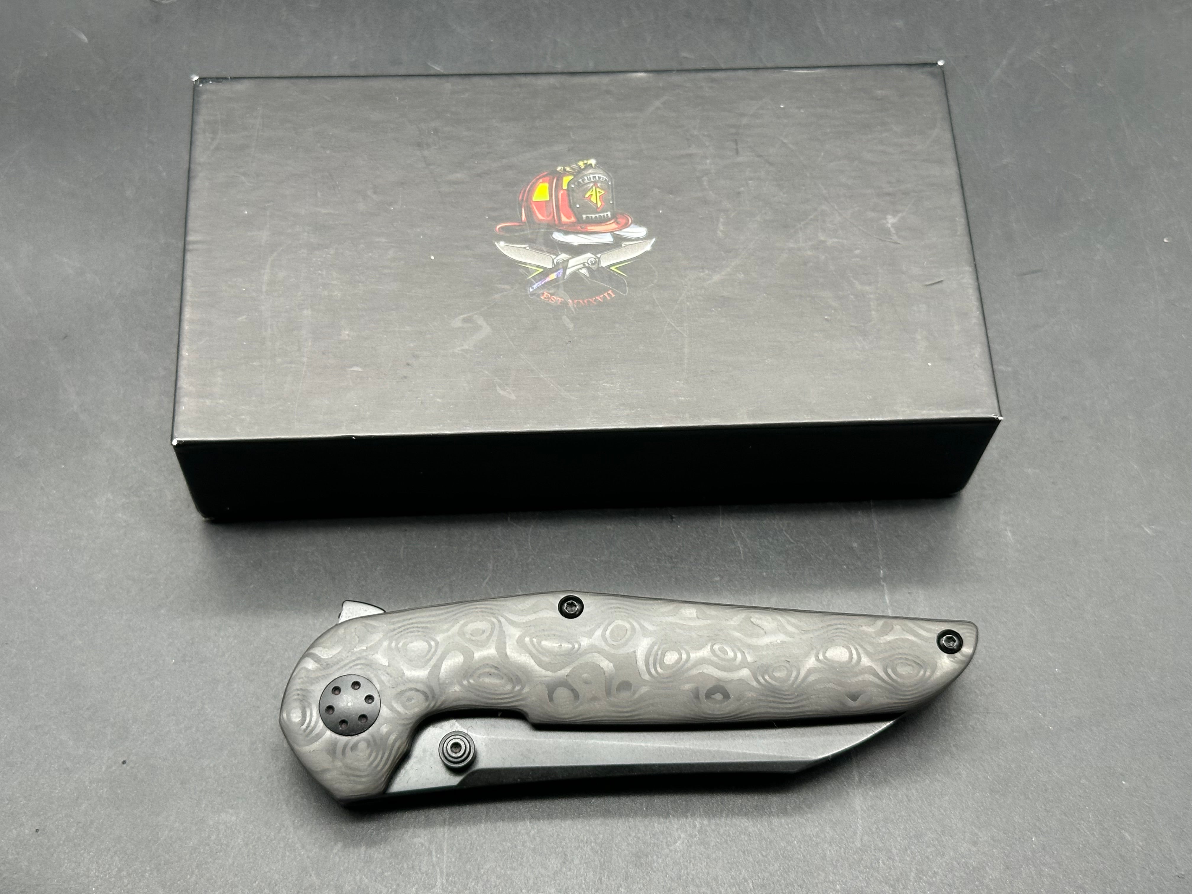 Adam Purvis Progeny 3.5 inch blackwashed, M390 blade. Raindrop carb fiber scales