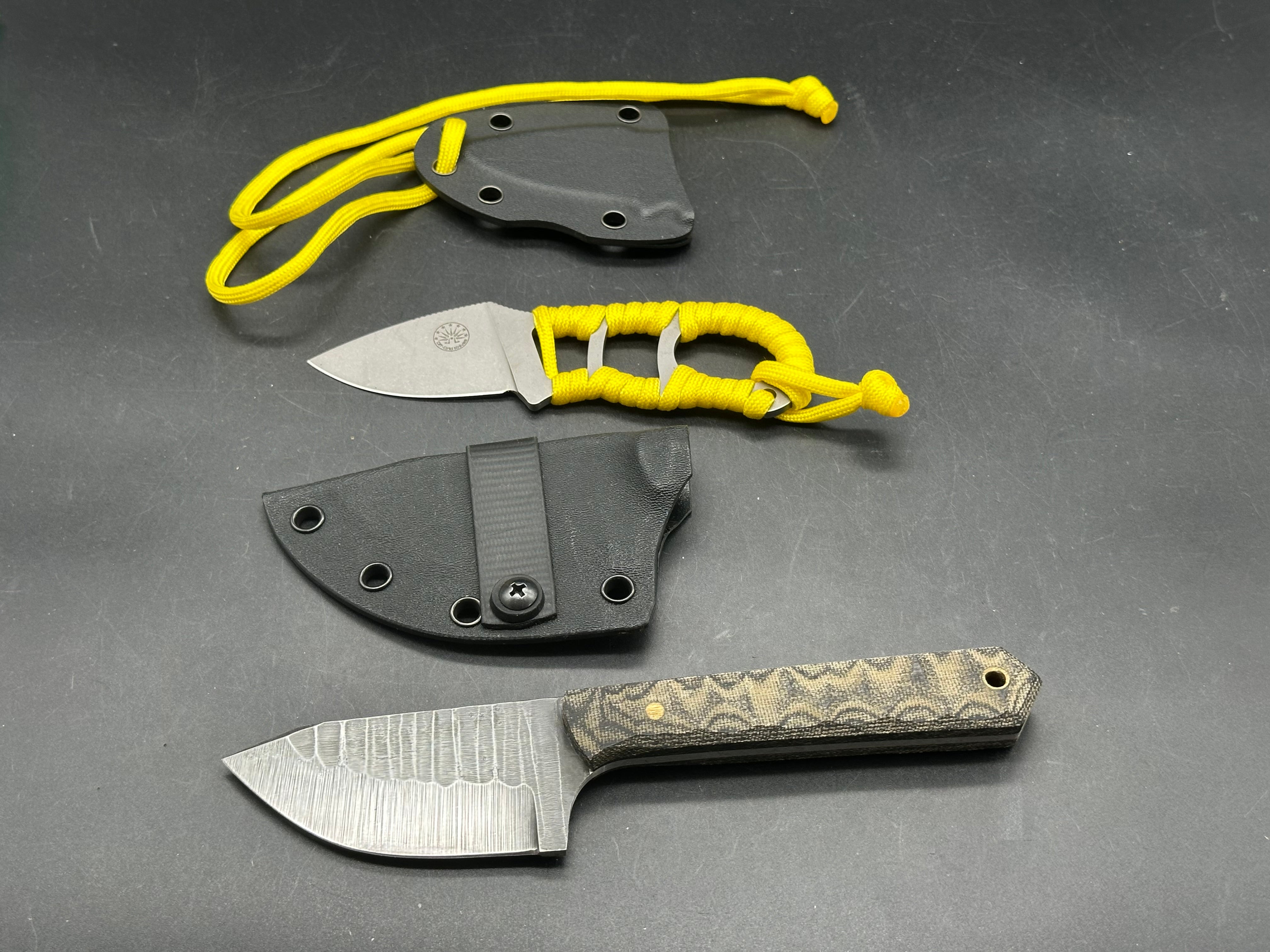 Charles Jones Blades Bonepicker in 3V steel with black micarta handles & Off Grid Knives All Day Fixie Neck knife in D2