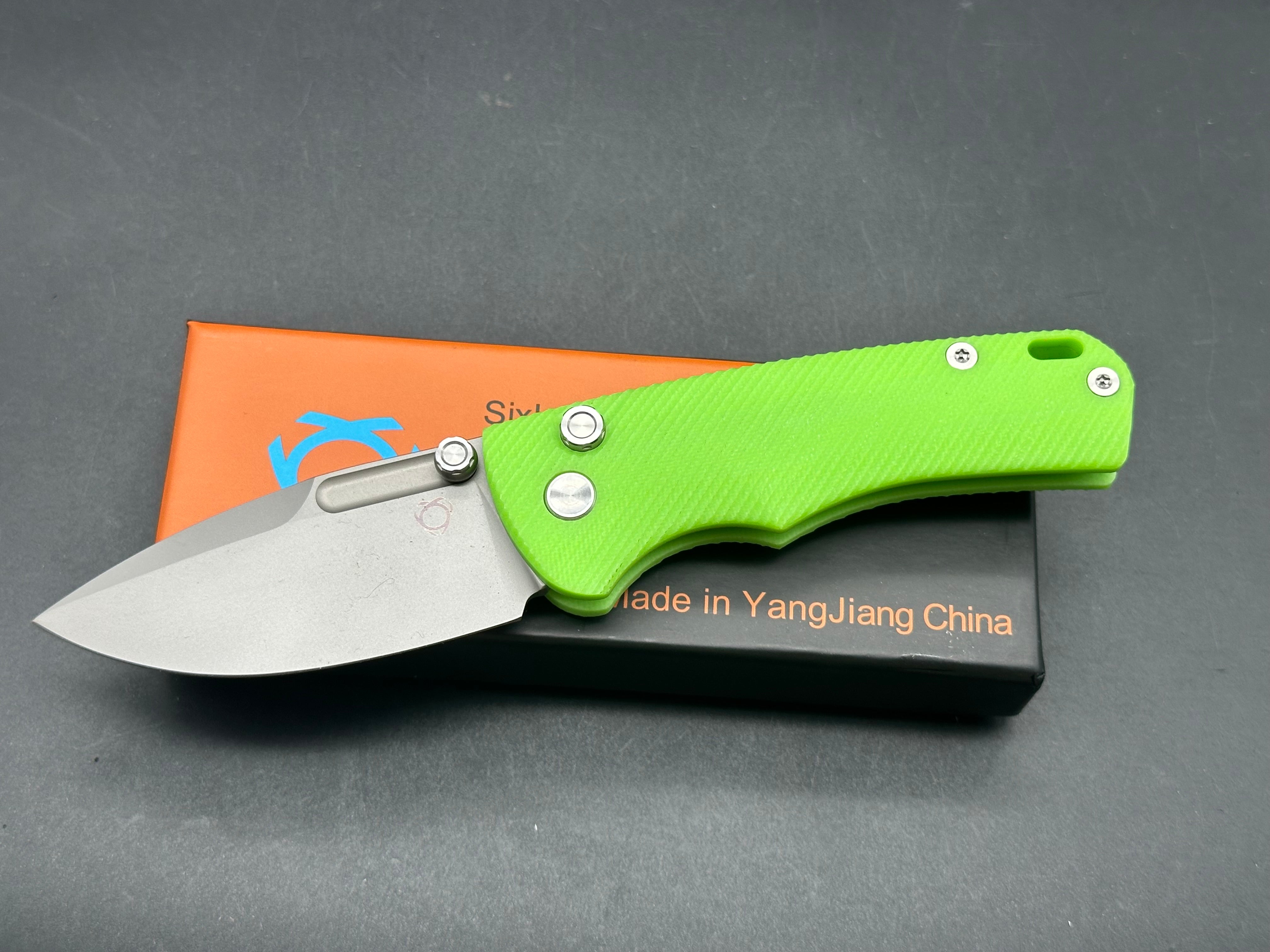 Sixleaf SL-16 button lock, fluorescent green G10 scales, D2 blade.