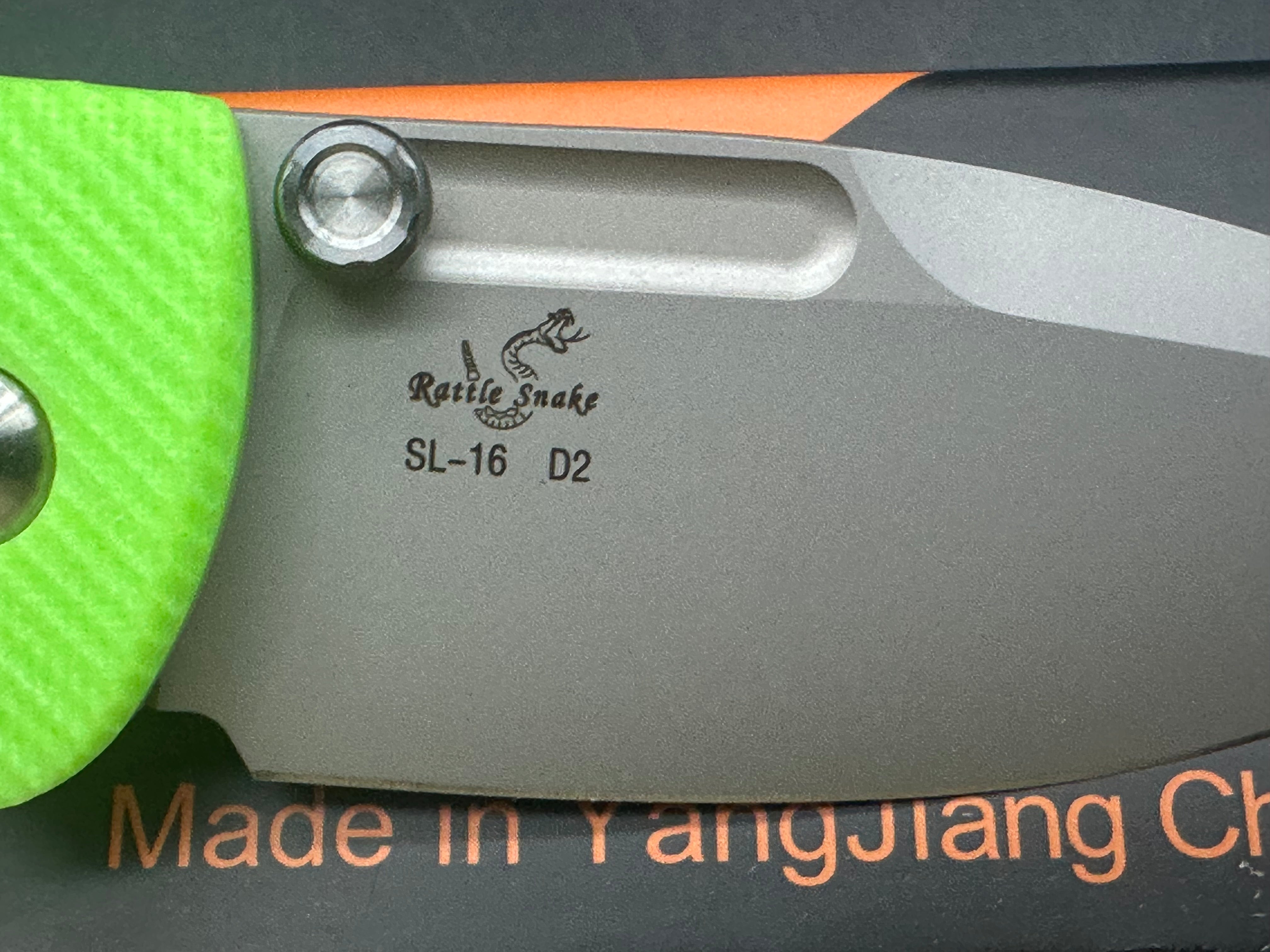 Sixleaf SL-16 button lock, fluorescent green G10 scales, D2 blade.