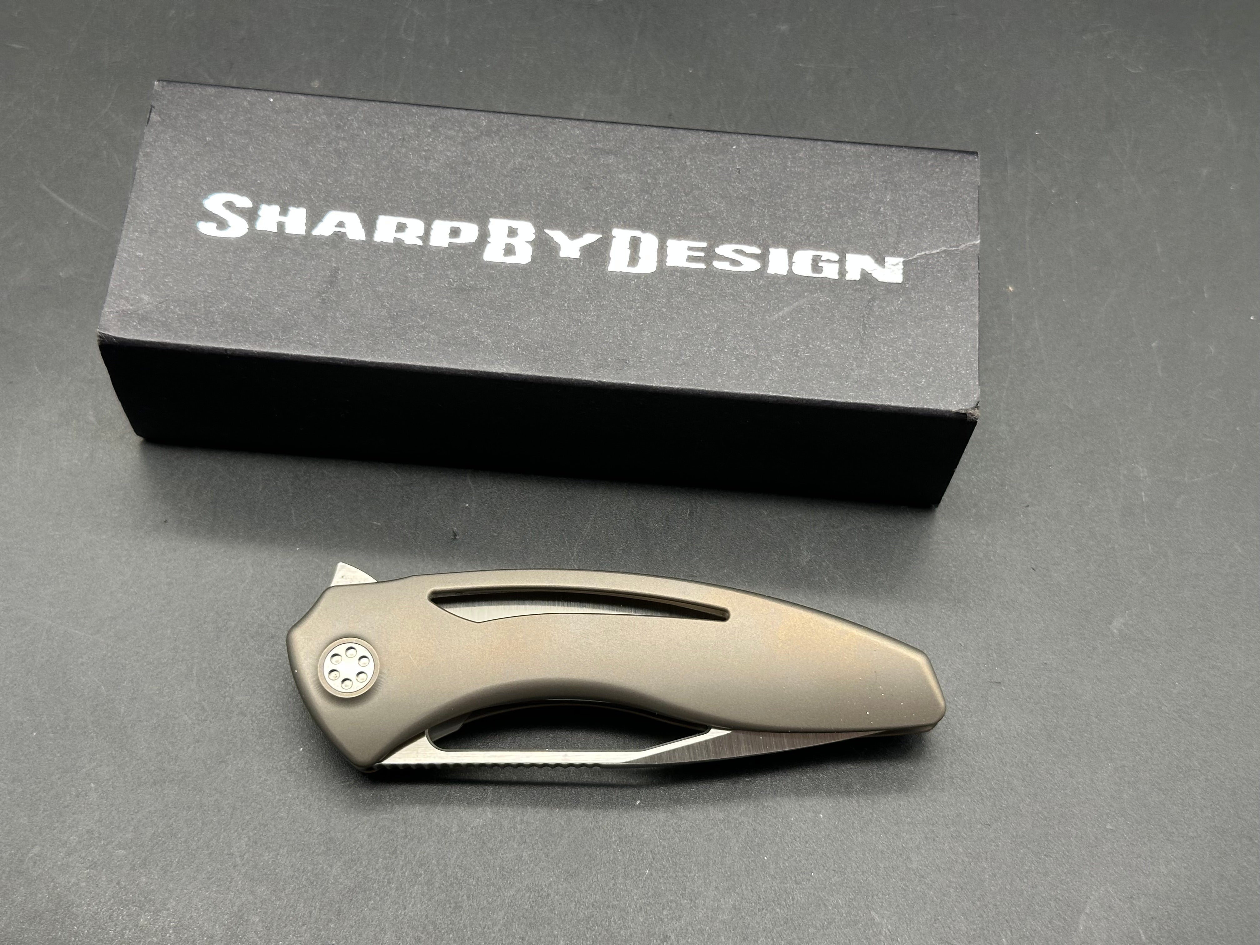 Sharp by Design Void Bronze titanium handle w/M390 blade