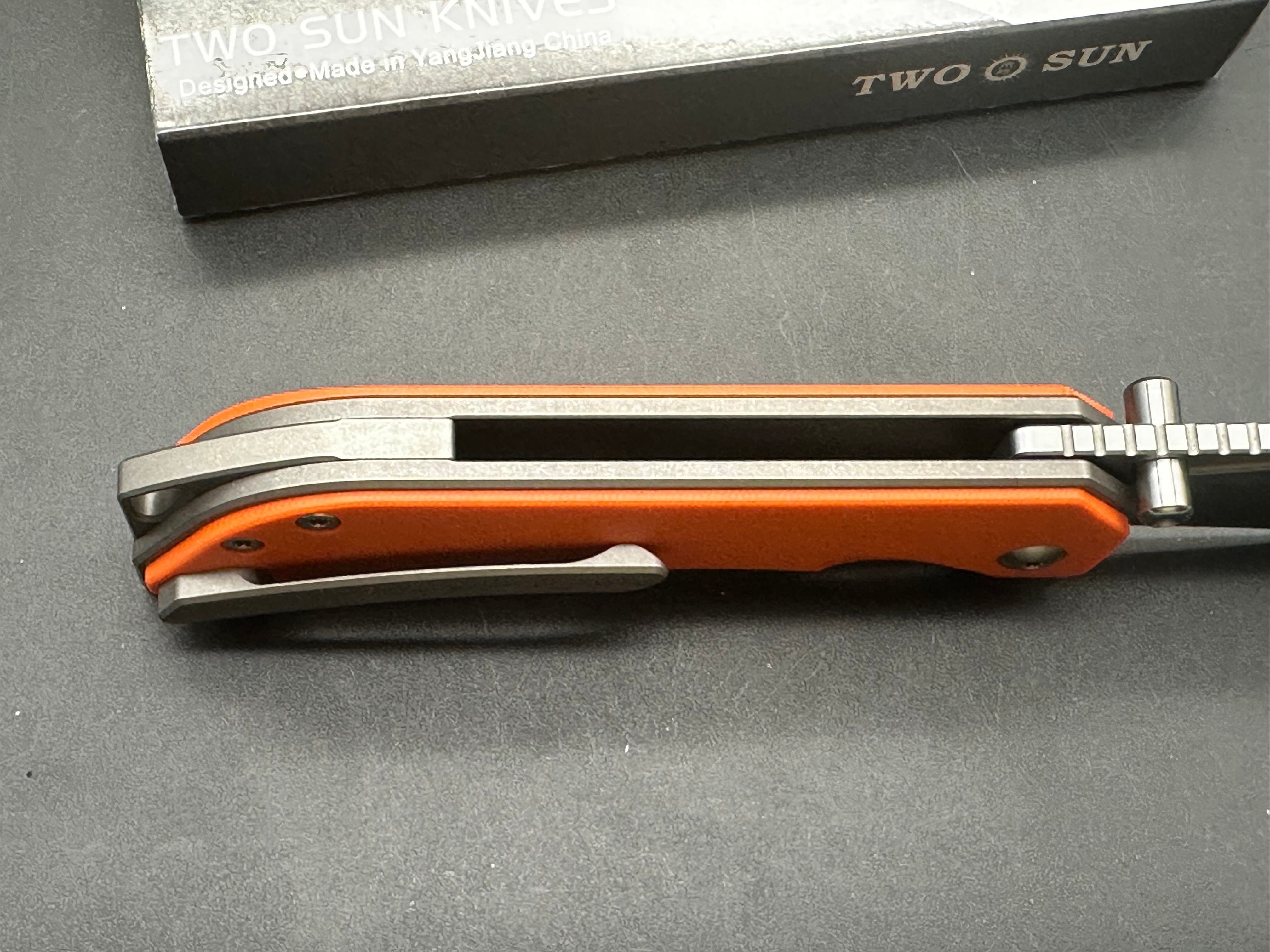 TwoSun TS472 Wong design, liner lock, titanium and orange G10 scales, 14c28n blade