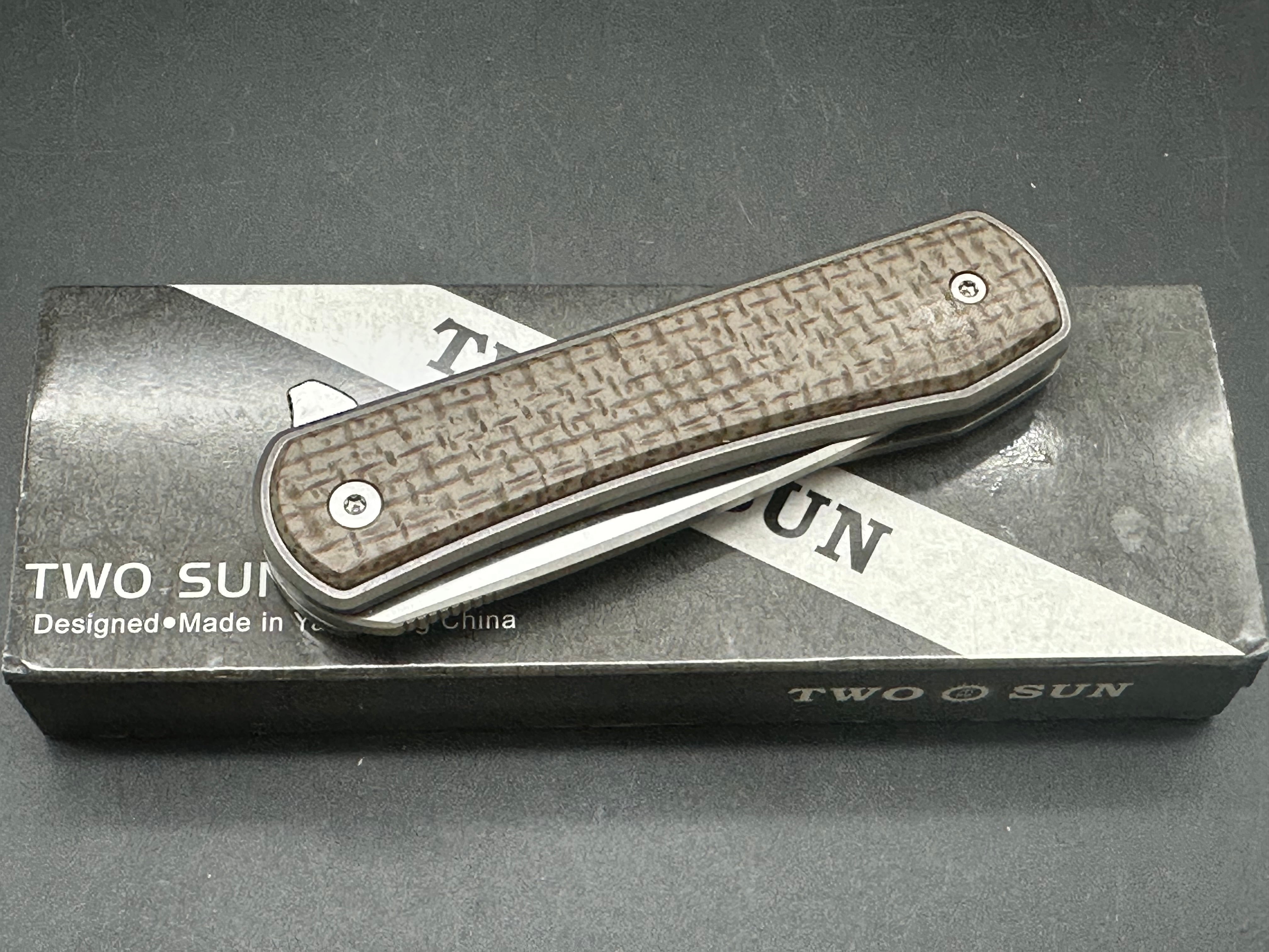 TwoSun TS335 YX design, double detent slip joint, titanium and micarta scales, 14c28n blade