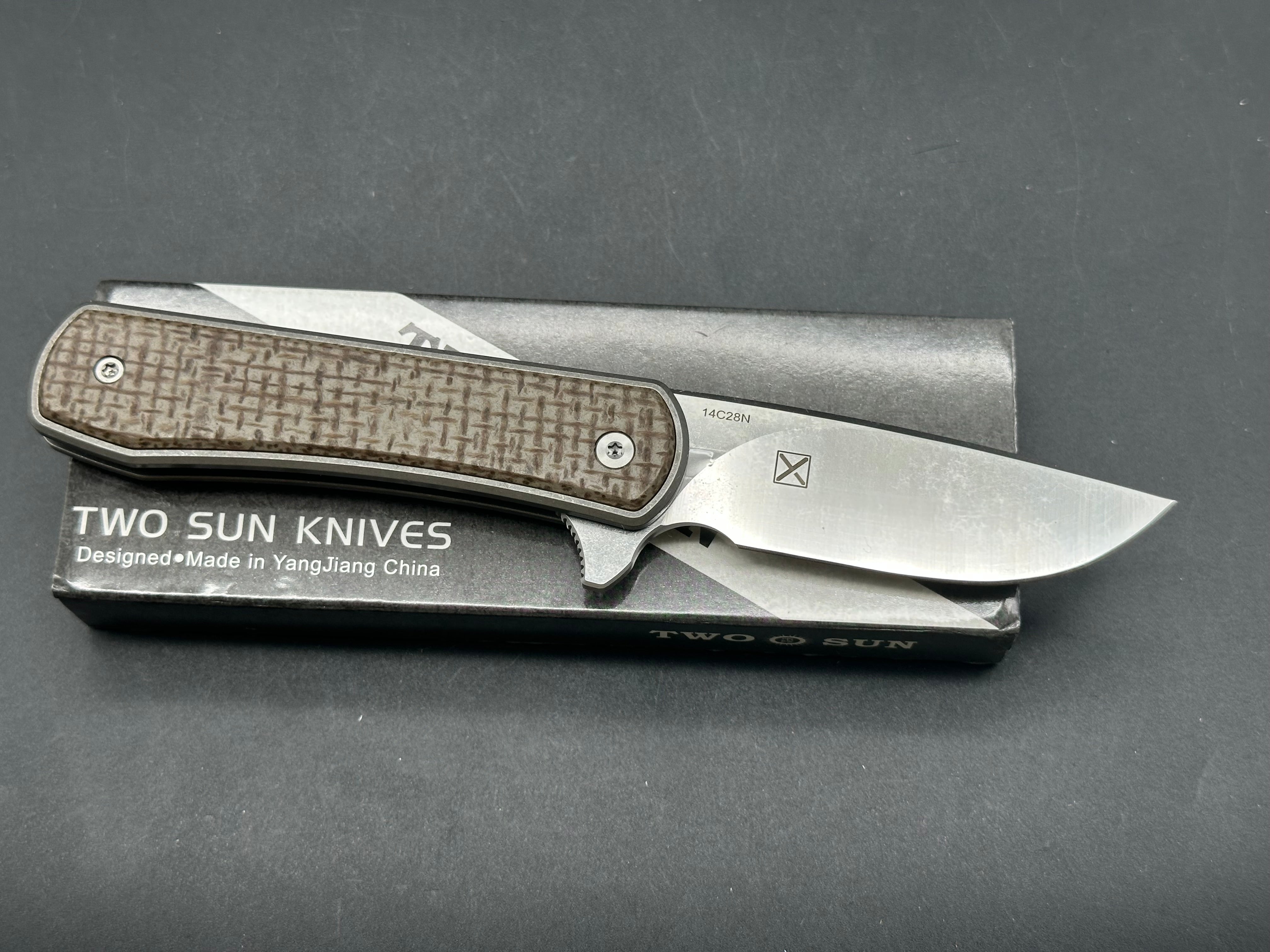 TwoSun TS335 YX design, double detent slip joint, titanium and micarta scales, 14c28n blade