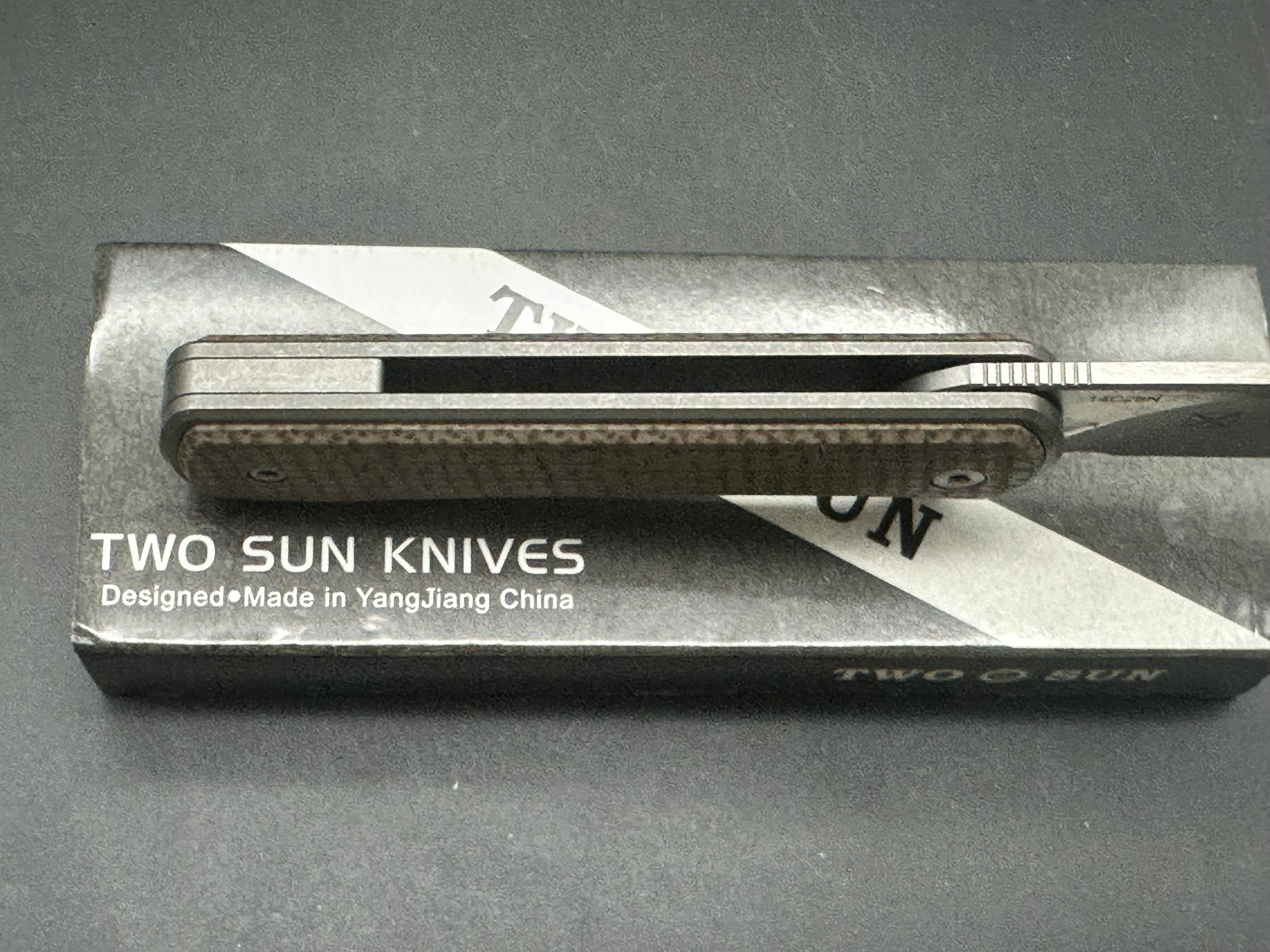 TwoSun TS335 YX design, double detent slip joint, titanium and micarta scales, 14c28n blade