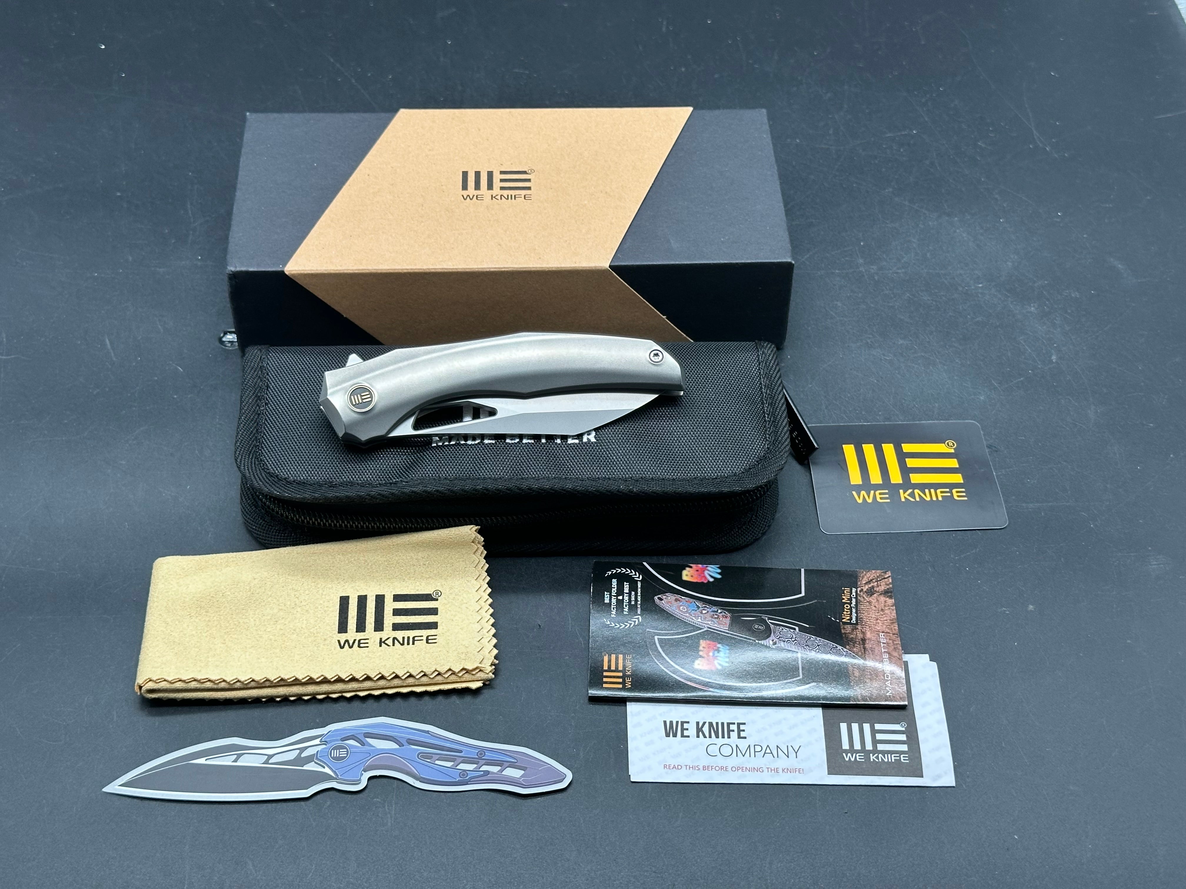 WE Knife Co. Ignio Polished Titanium 20CV blade Anodized clip