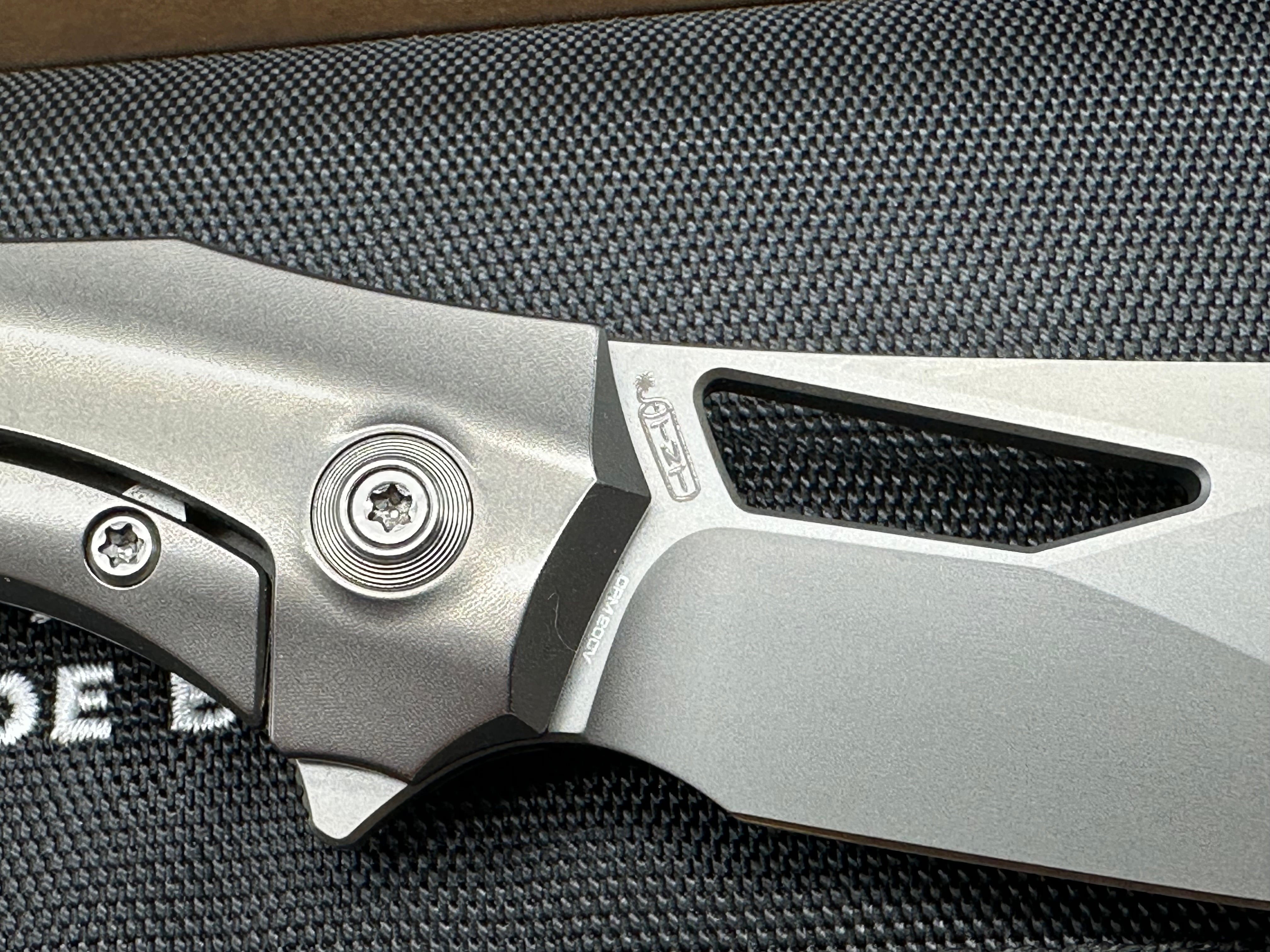 WE Knife Co. Ignio Polished Titanium 20CV blade Anodized clip