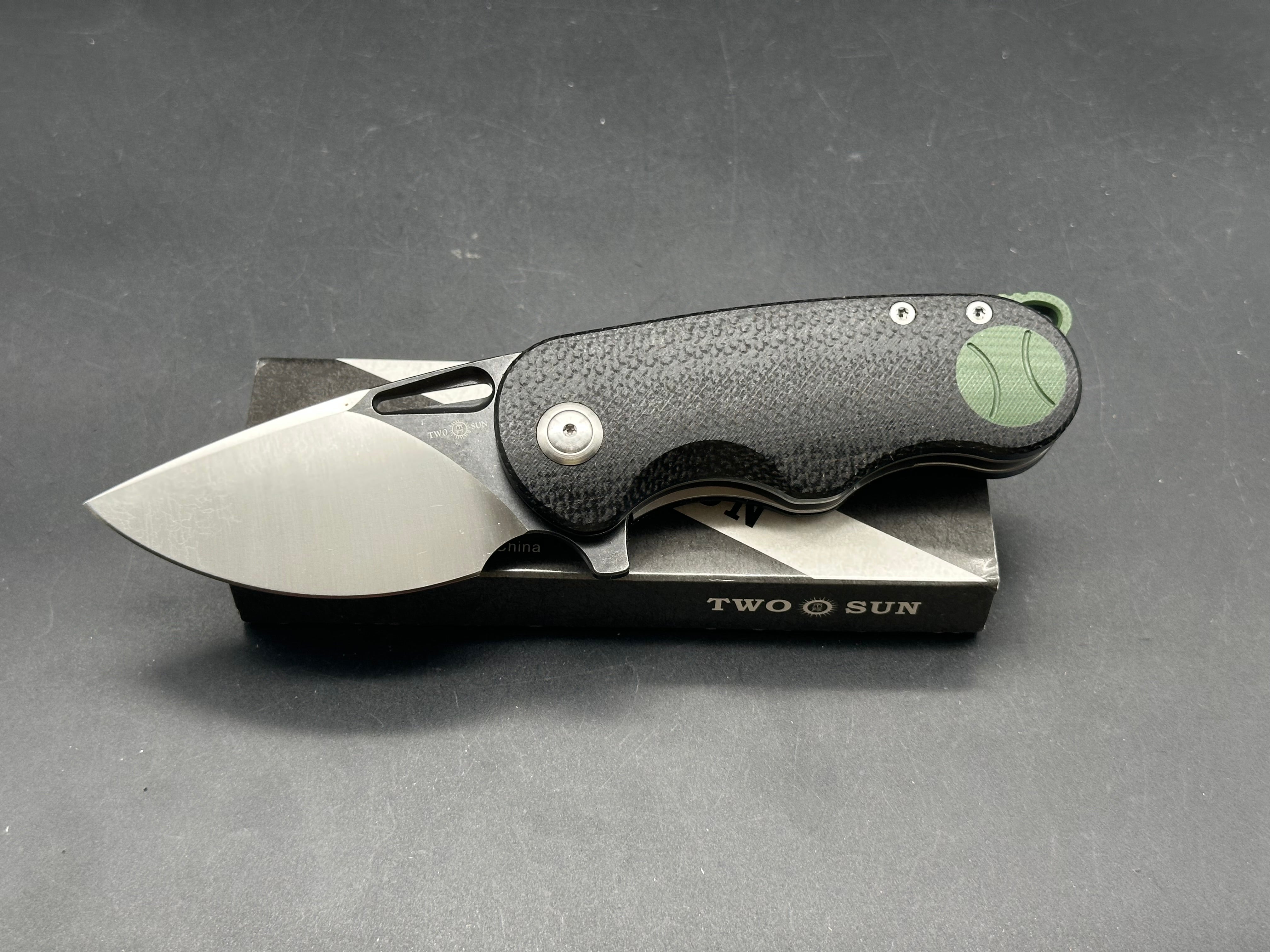 TwoSun TS506  David Chen design, liner lock, black micarta with green G10 inserts and back spacer, N690 blade