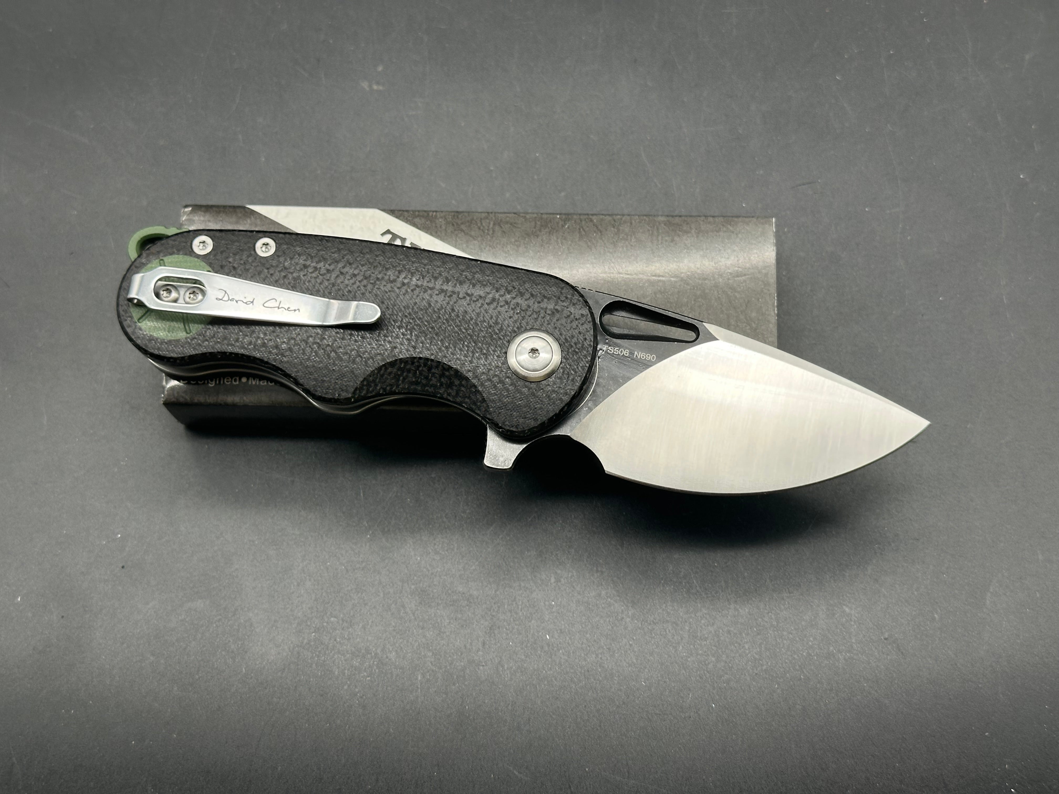 TwoSun TS506  David Chen design, liner lock, black micarta with green G10 inserts and back spacer, N690 blade