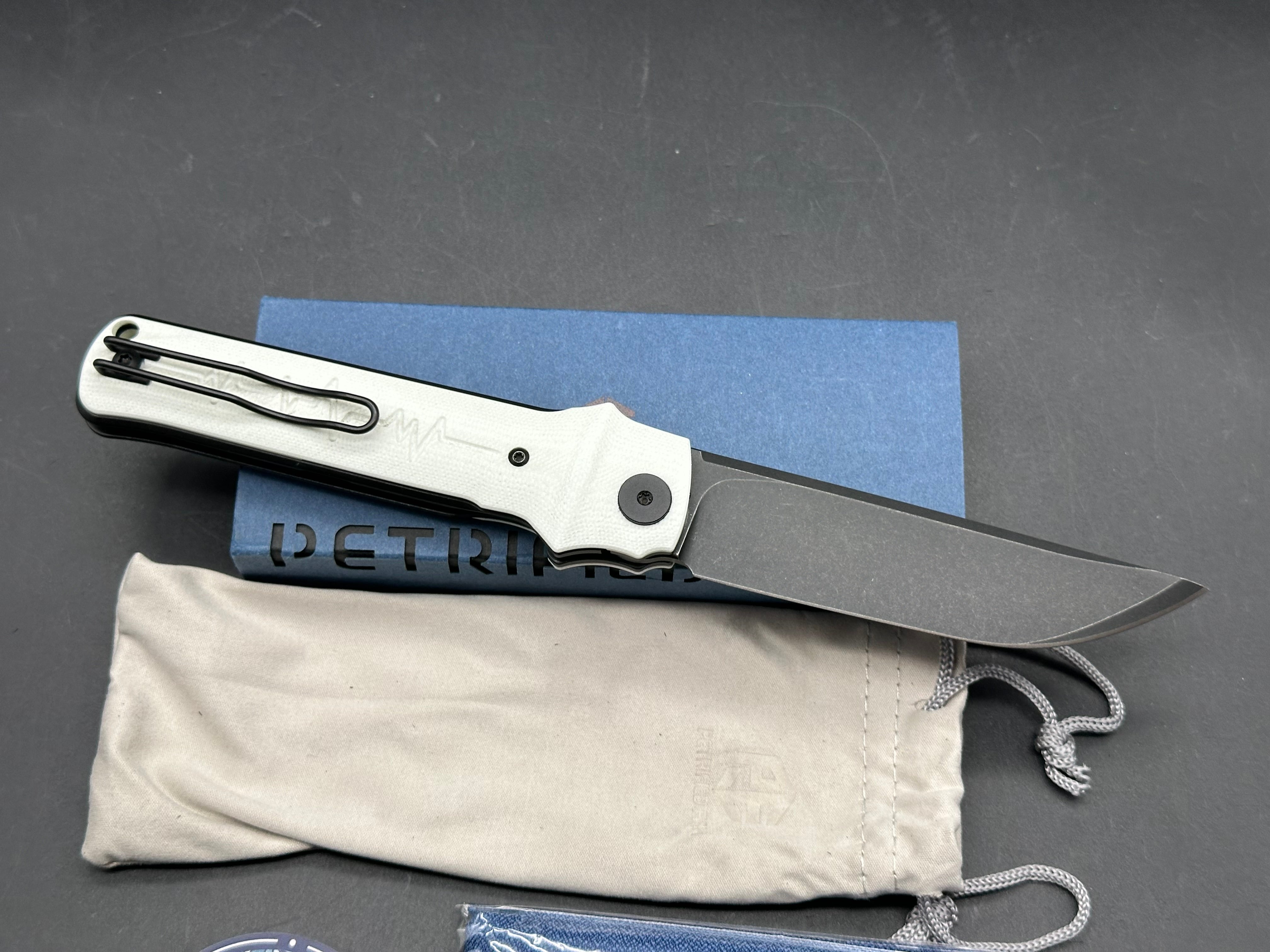 Petrified Fish Tena Folding Knife White G10 Handle D2 Plain Black Blade