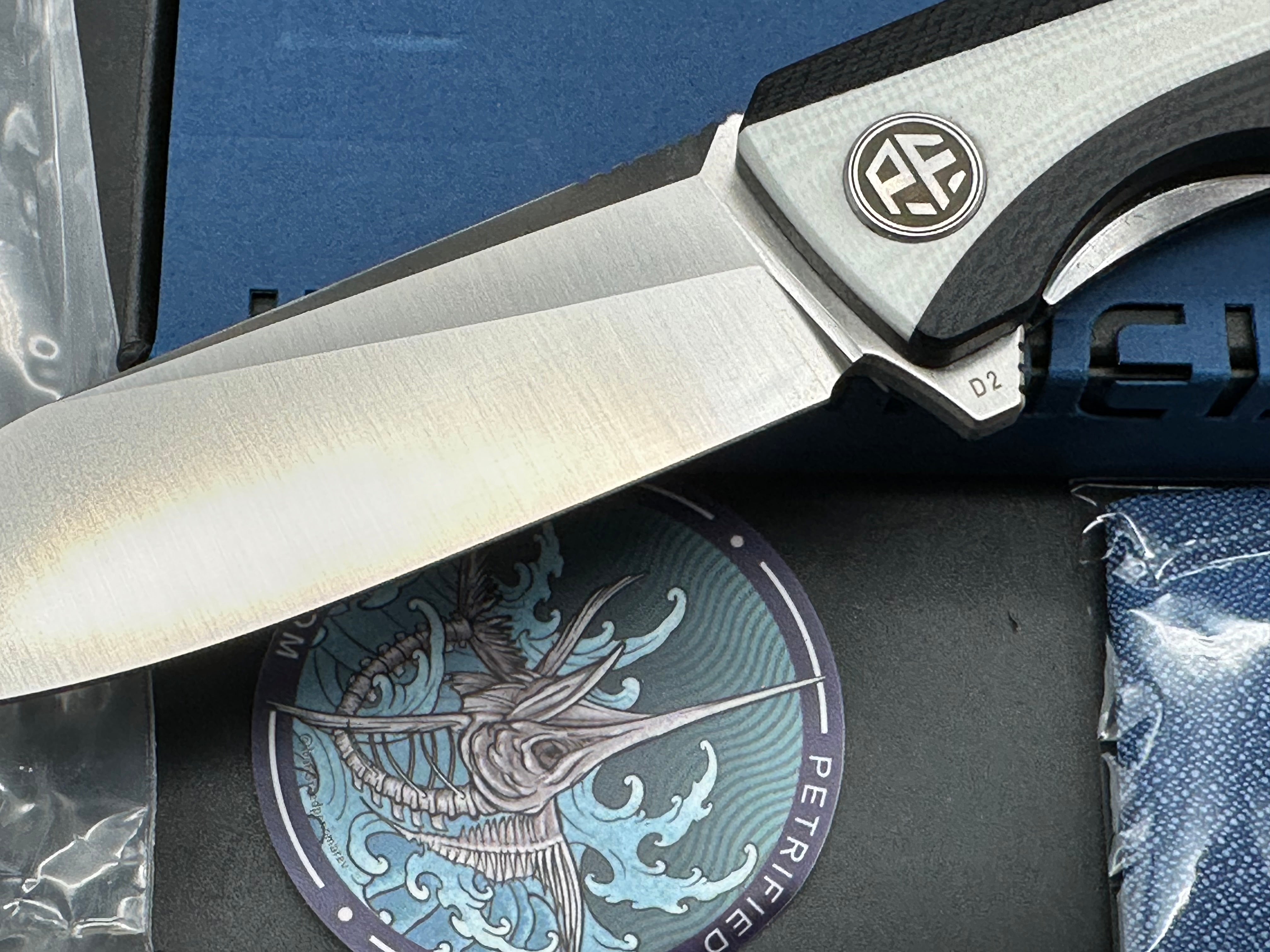Petrified Fish Forward Folding Knife Black/White G10 Handle D2 Plain Edge Stonewash Finish