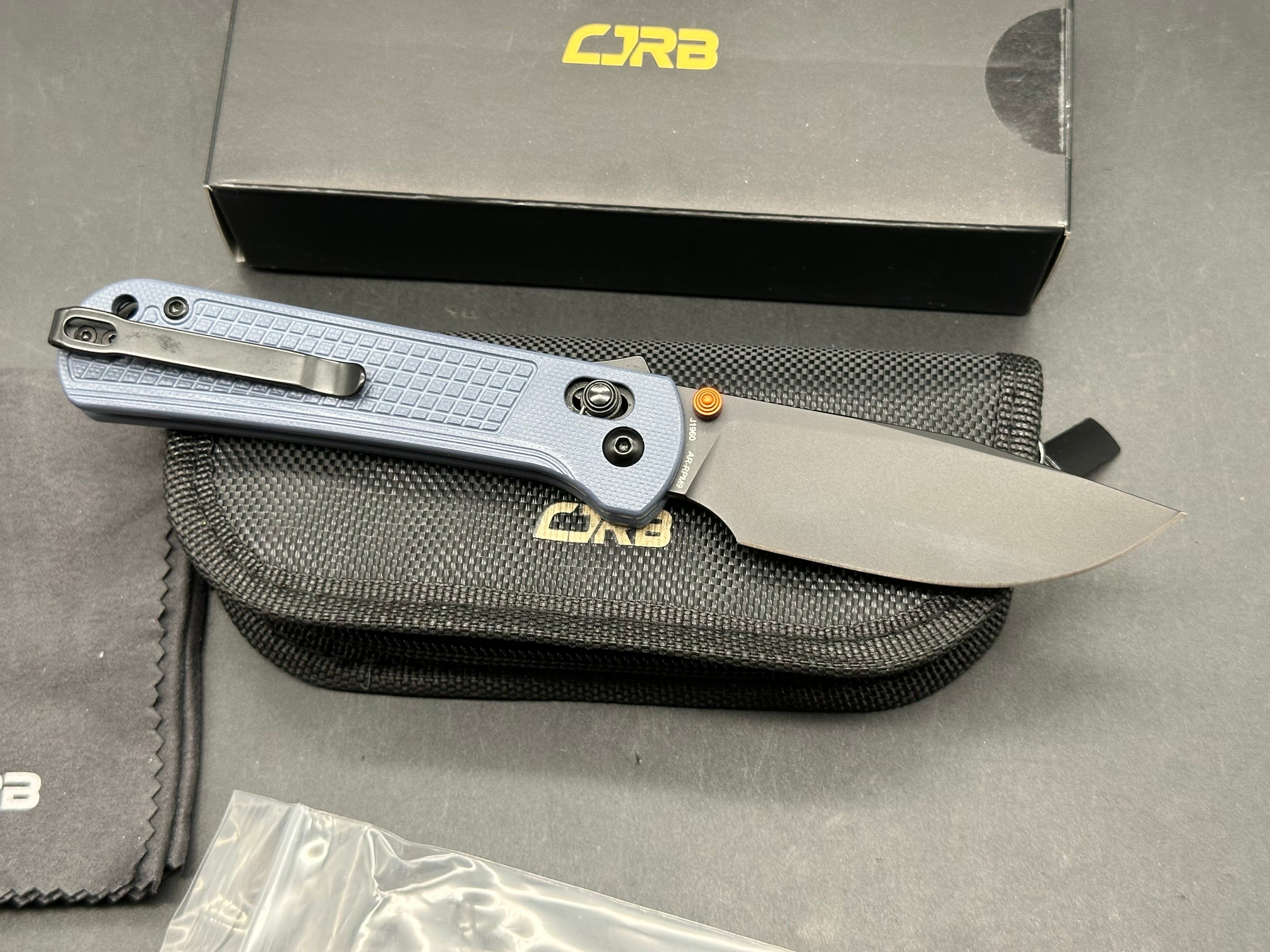 CJRB Bolt Folding Knife Blue G10 Handle AR-RPM9 Drop Point Plain Edge Black PVD Finish