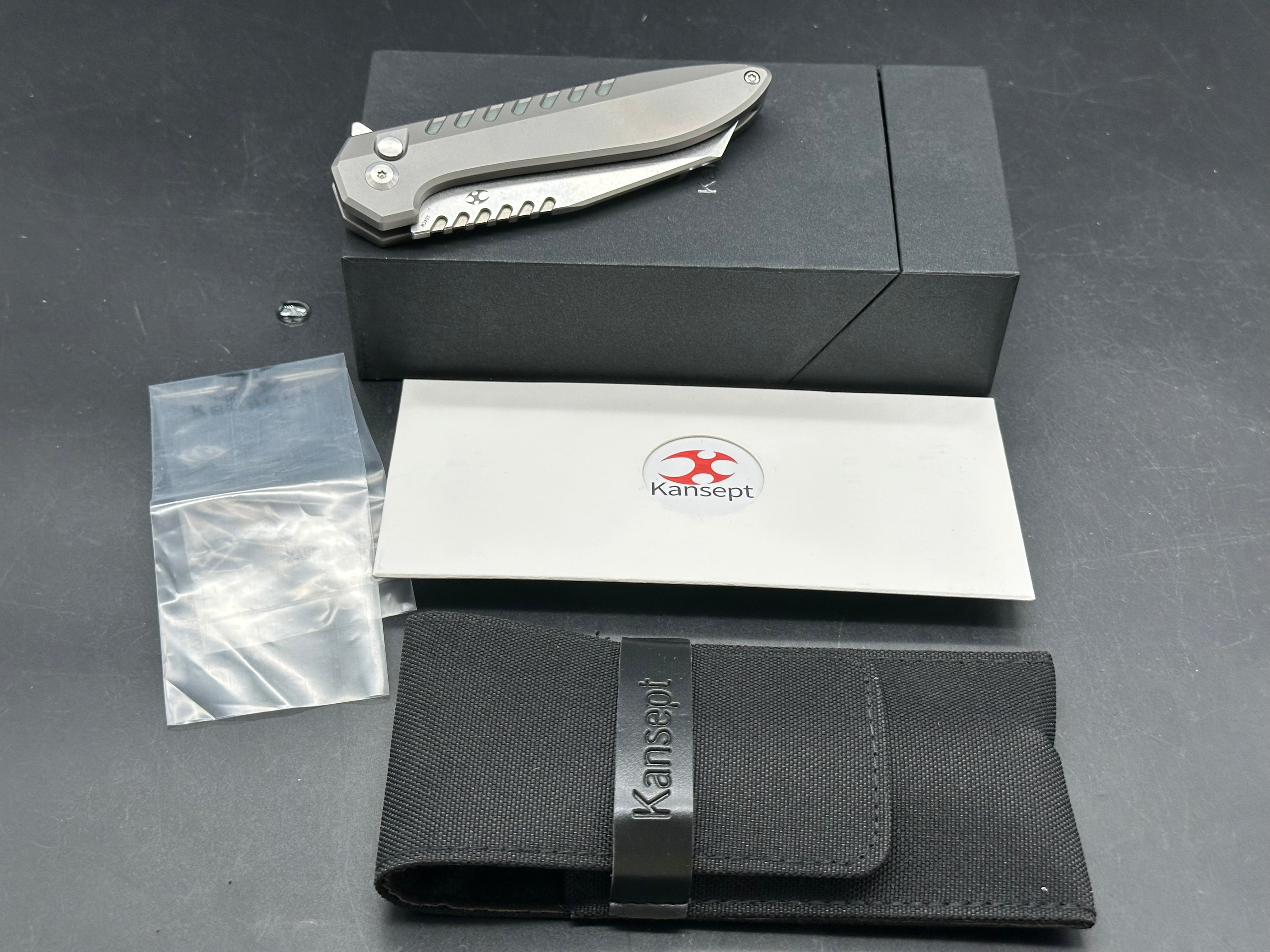 Kansept Kosame Button Lock Flipper Knife 3.37" 154CM Wharncliffe Blade, Stonewashed Titanium Handles