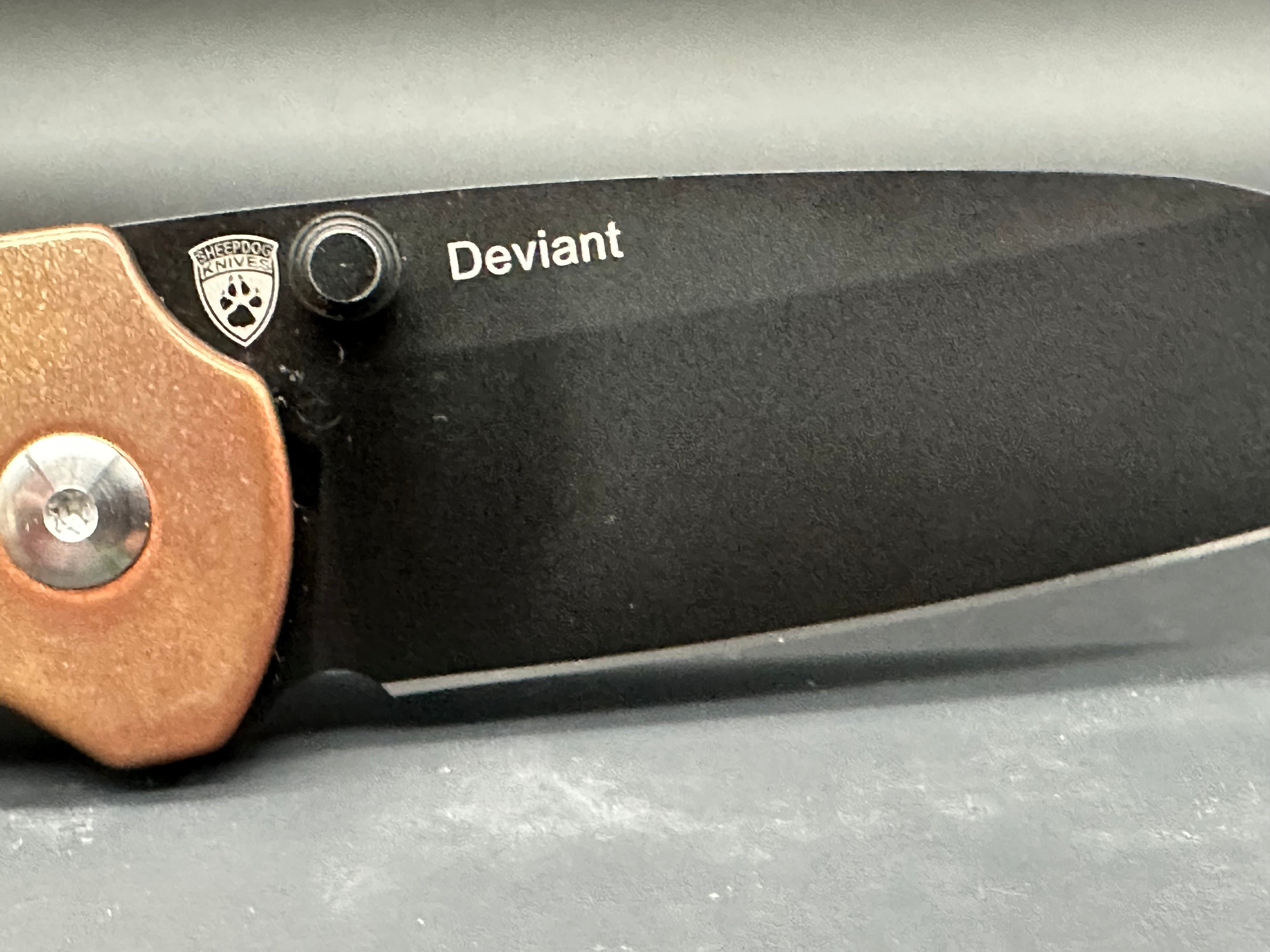 Kizer Deviant copper/micarta M390