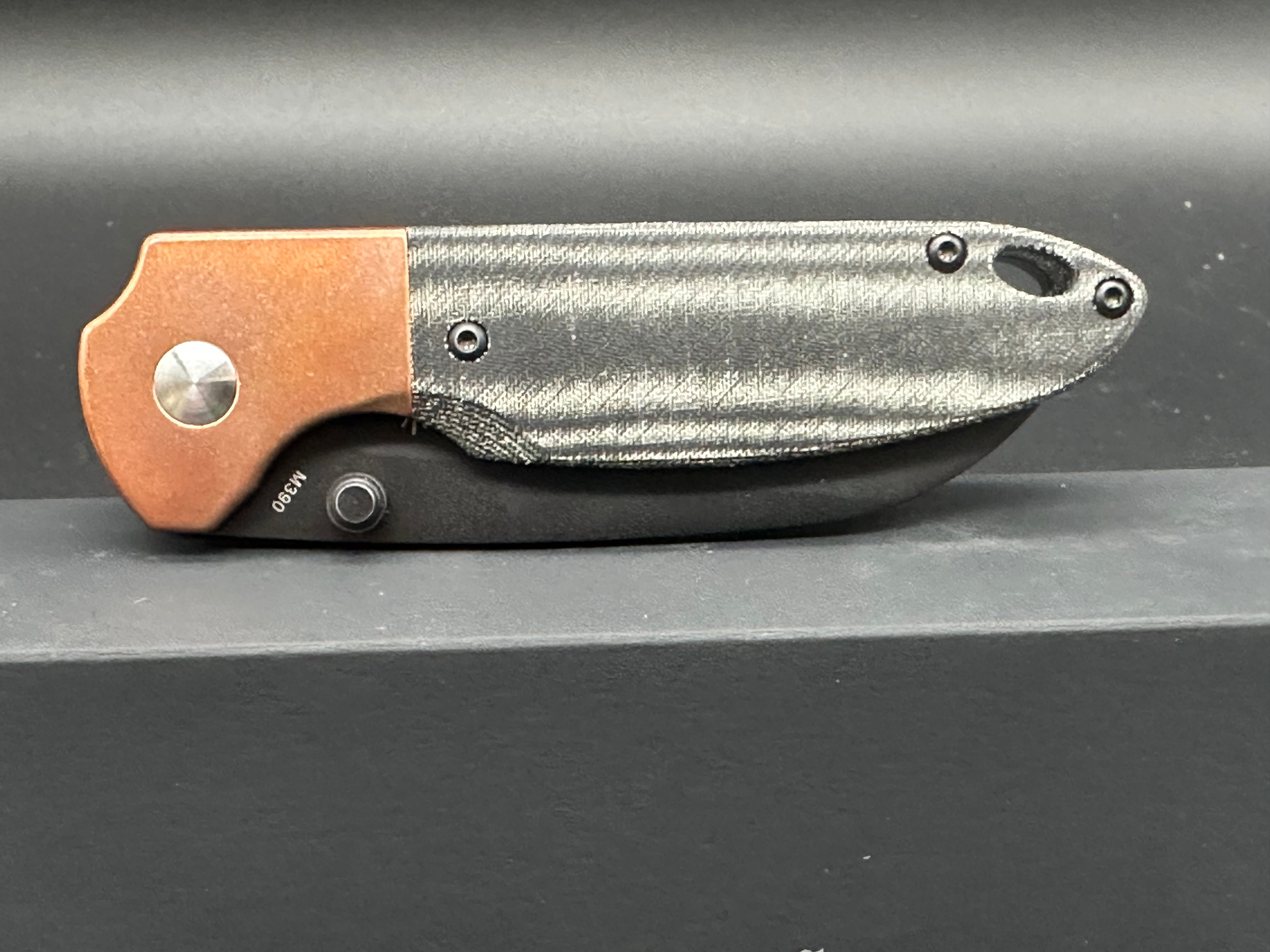 Kizer Deviant copper/micarta M390