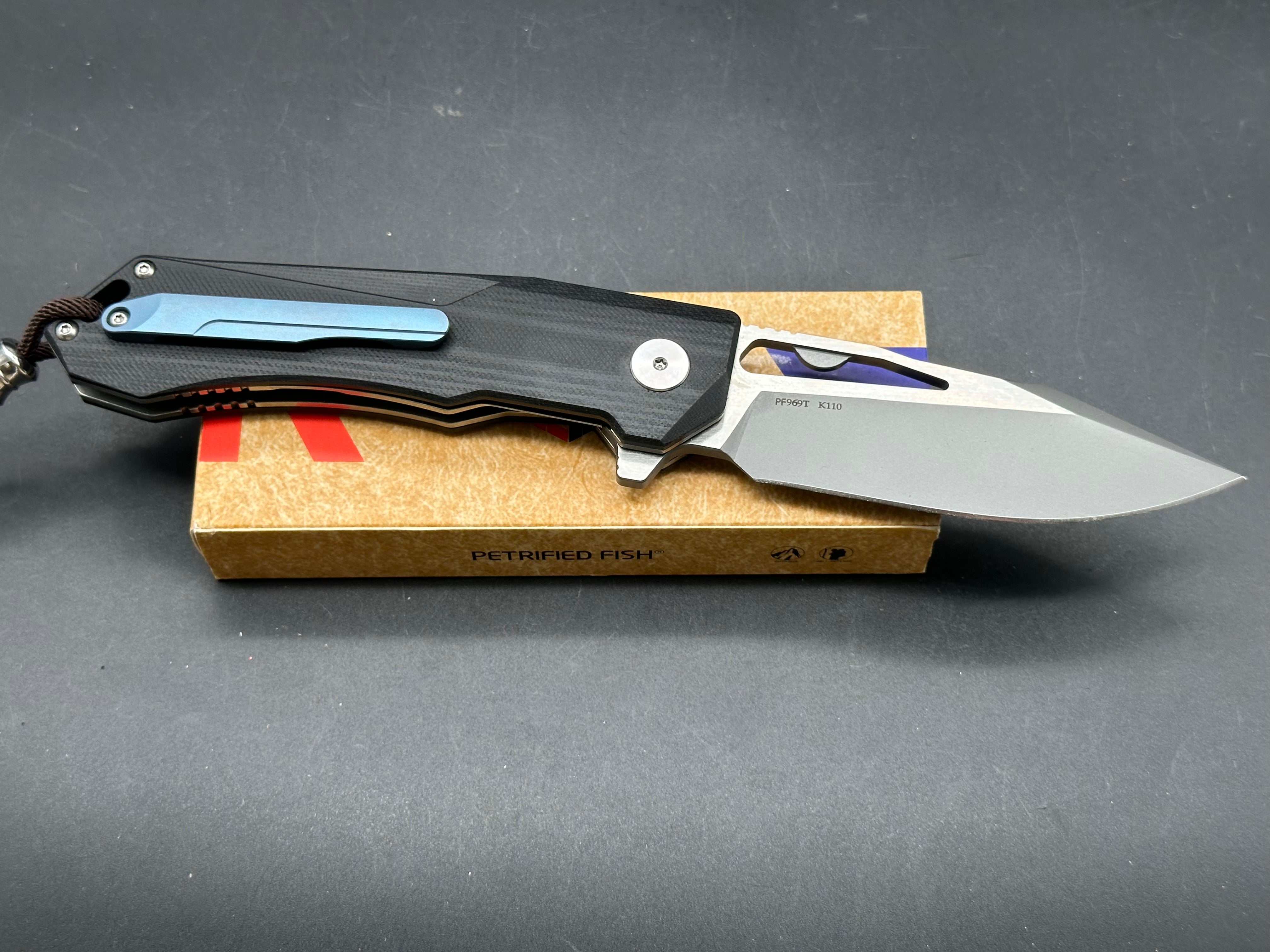 Petrified fish PF969 K110 steel blade G10 handle titanium alloy clip