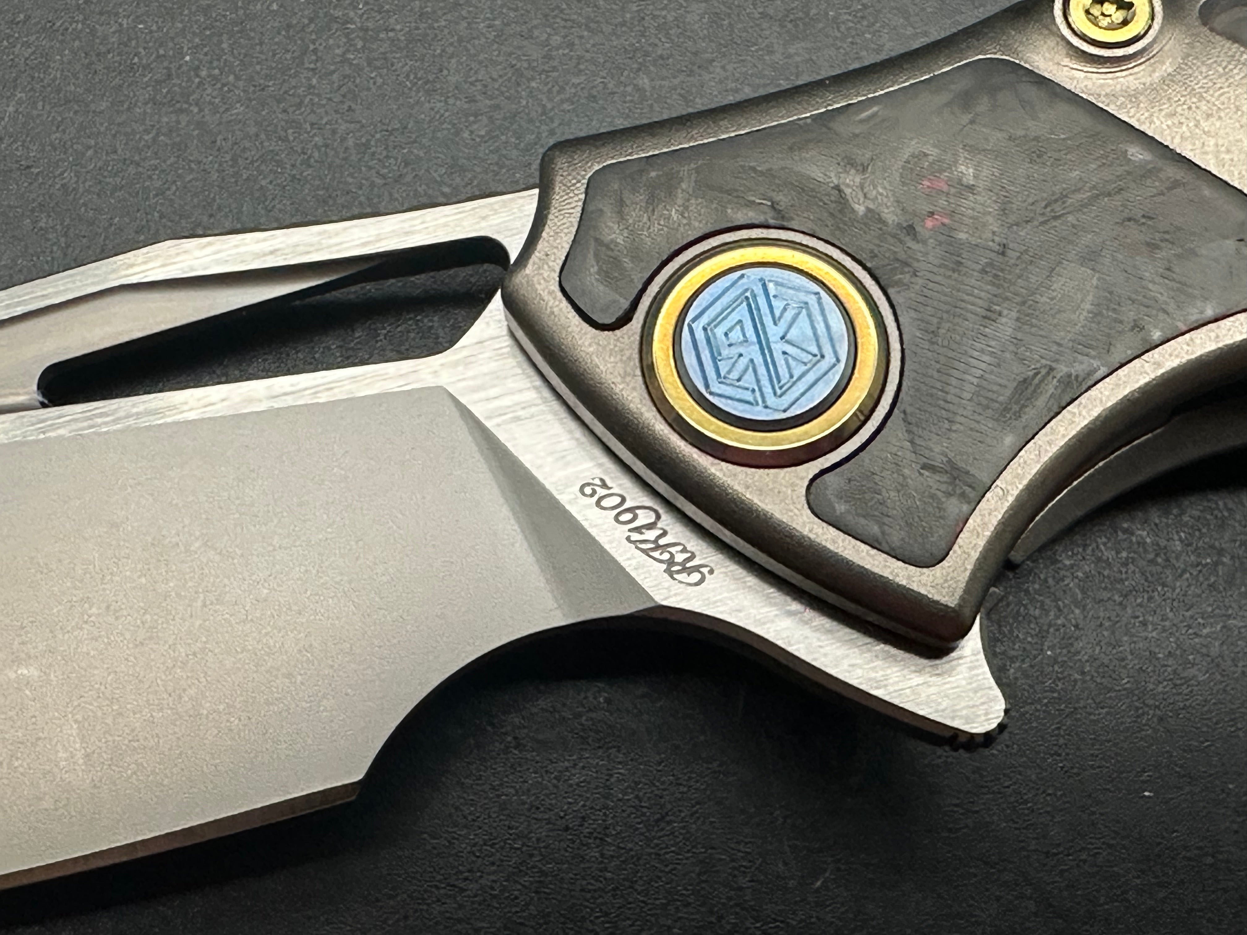 Rike Knife 1902-RCF titanium frame/red carbon fiber scales w/M390 blade