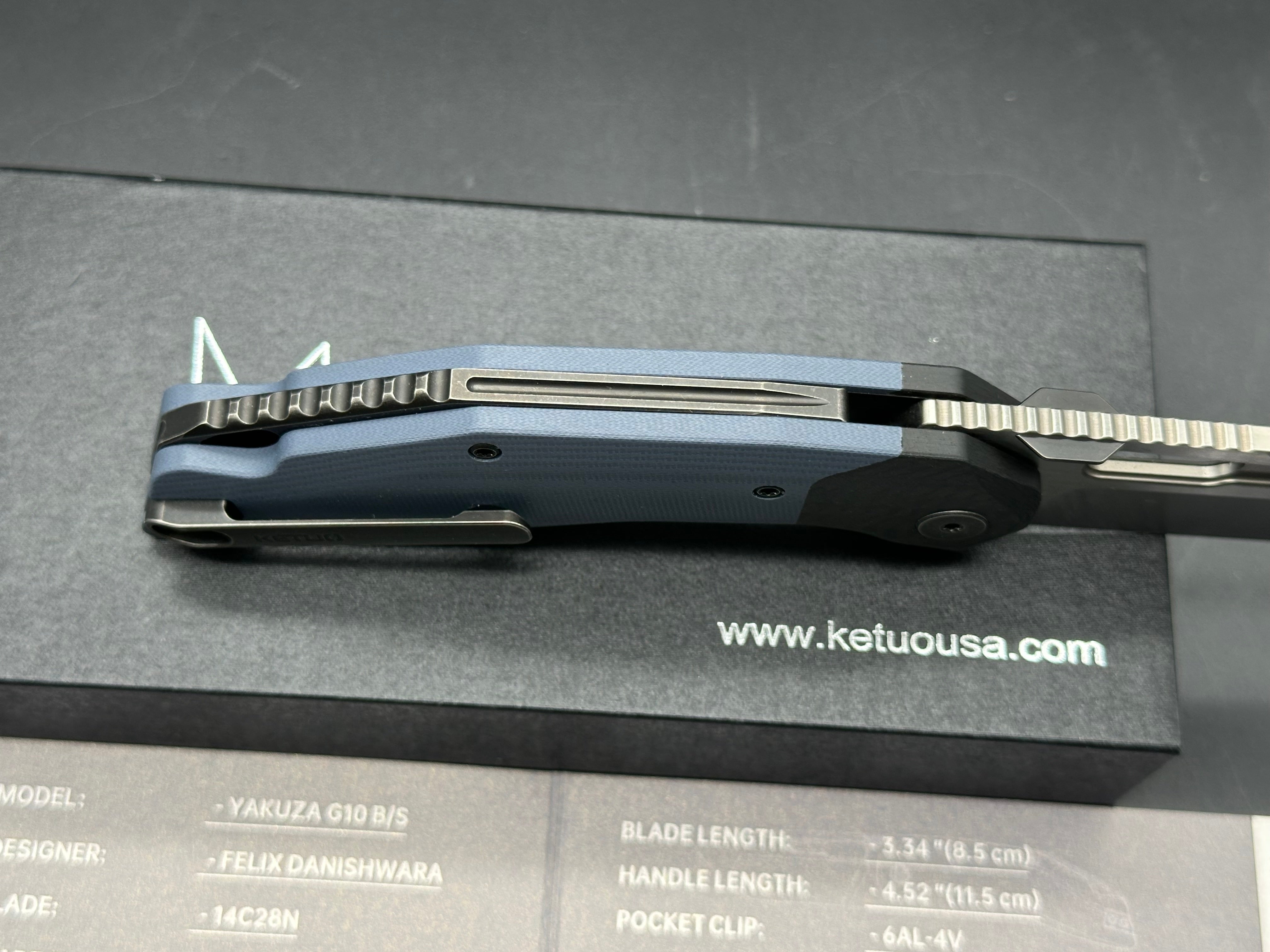 Ketuo Yakuza G-10 V2, Belt Satin14C28N Blade, Blue G-10 Handles with Carbon Fiber Bolsters, Blackwashed Steel Backspacer