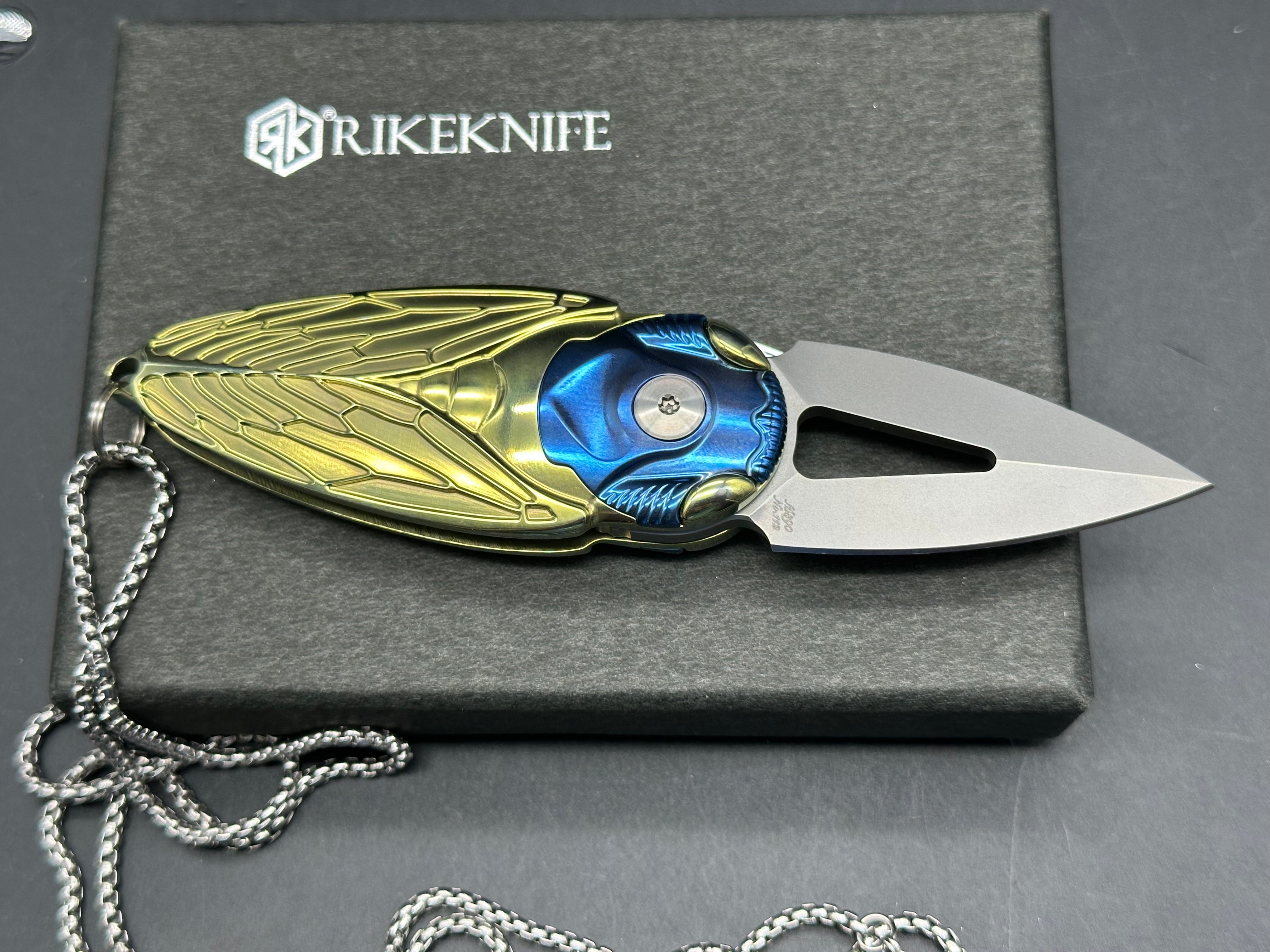 Rike Knife - Cicada Blue & Gold M390 button lock